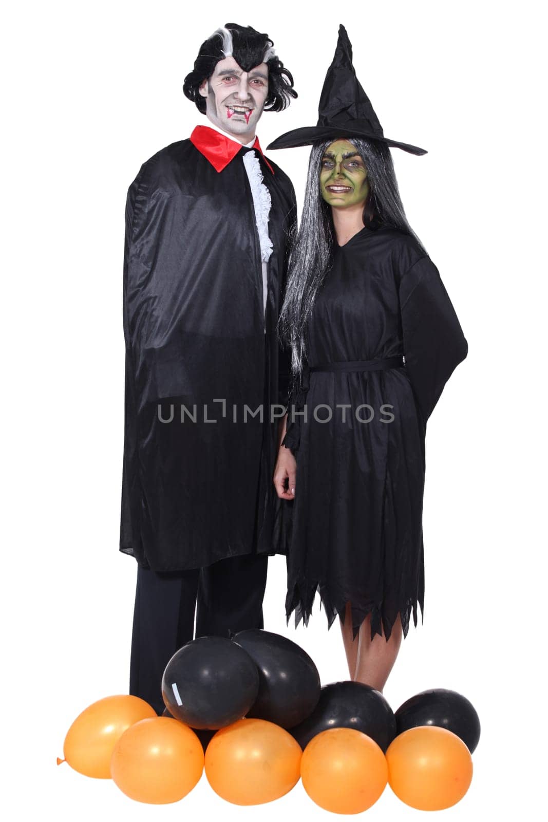 Couple disguised in vampire and witch