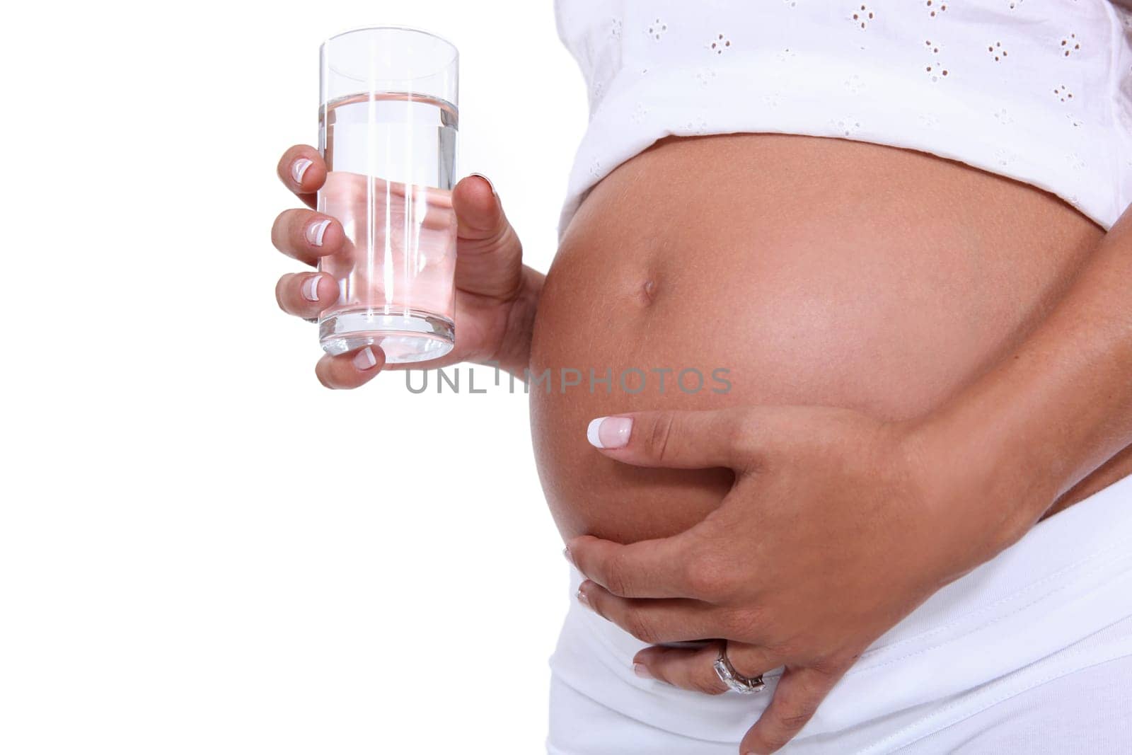 Pregnant woman holding a glass of water