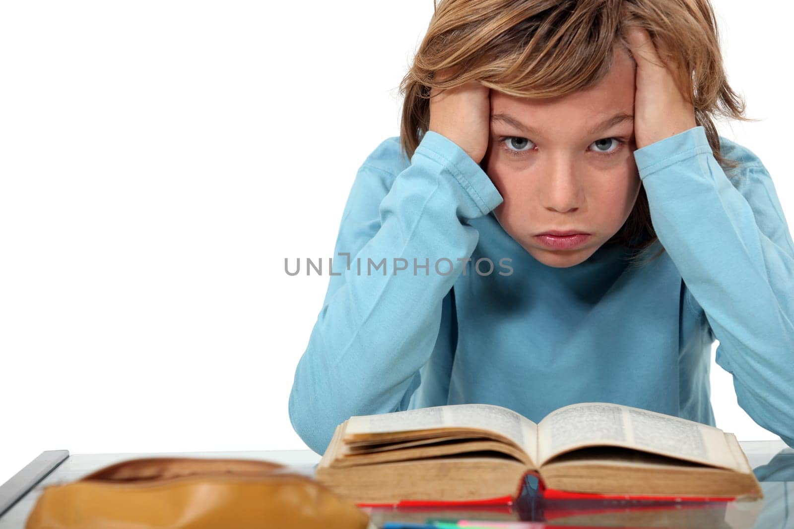 Boy exasperated with his homework