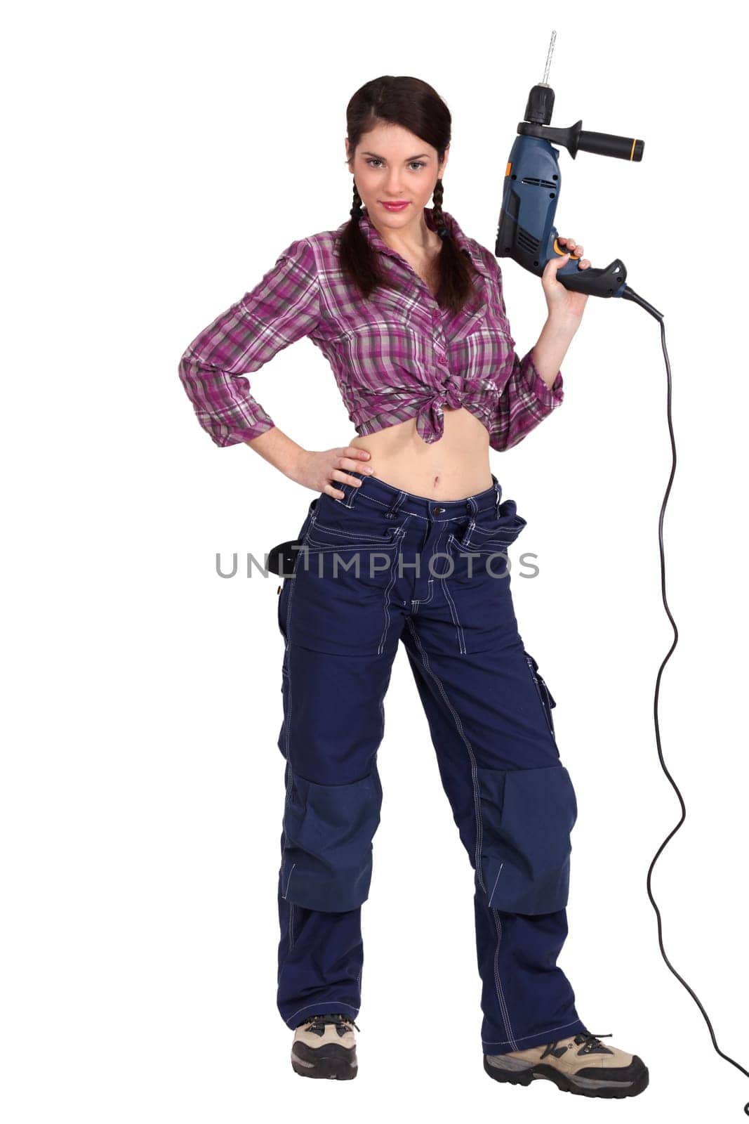 Sexy woman holding an electric screwdriver