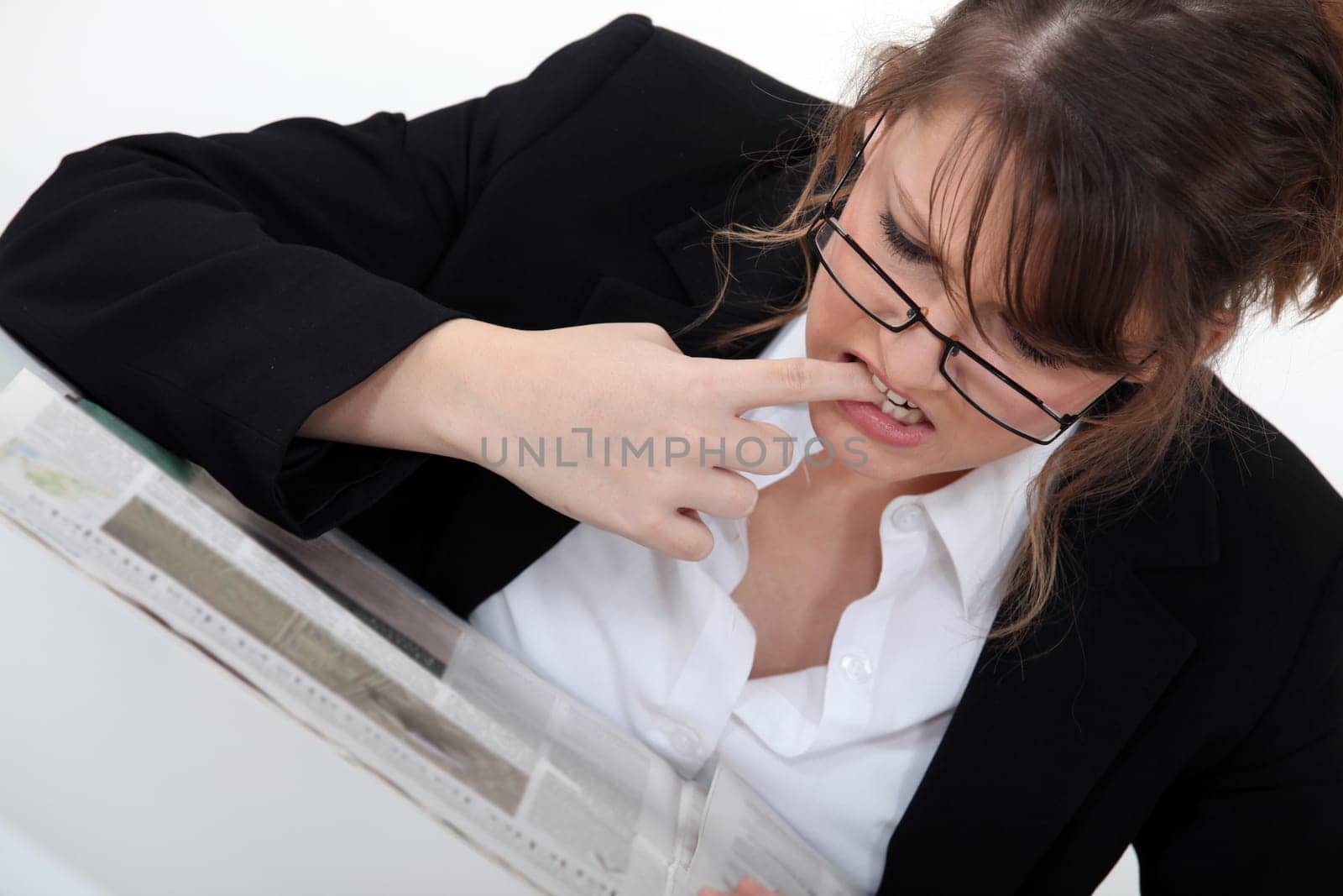 Woman looking for a new job in the newspaper
