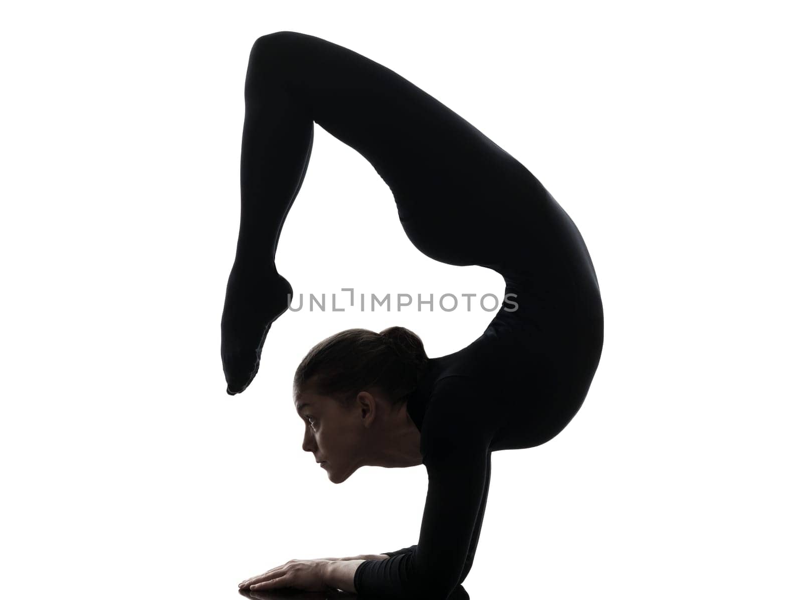 one caucasian woman contortionist practicing gymnastic yoga  in silhouette   on white background