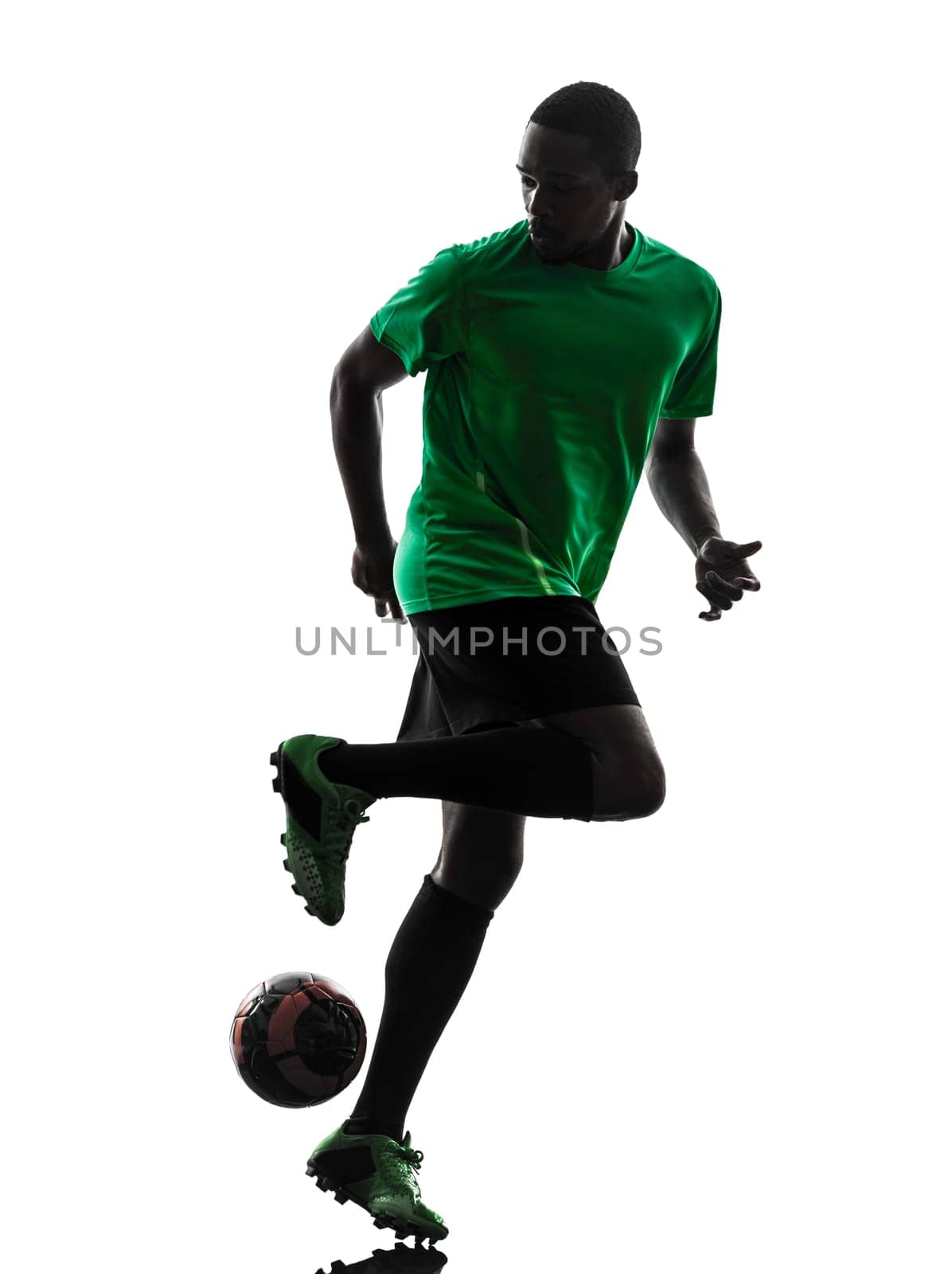 one african man soccer player green jersey in silhouette  on white background