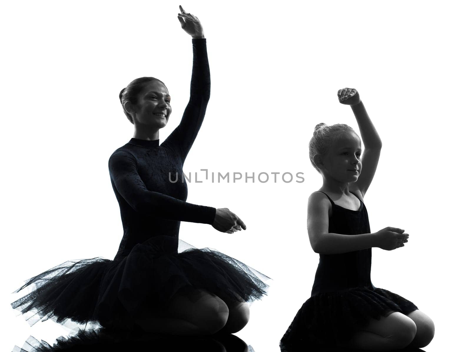 woman and  little girl   ballerina ballet dancer dancing in silhouette on white background