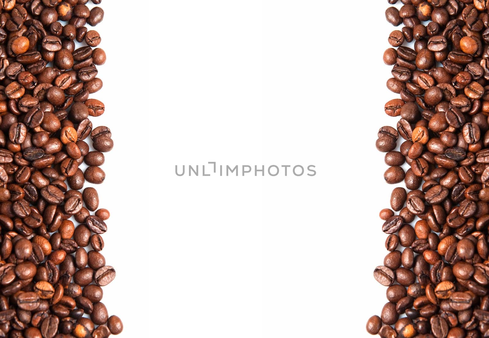 Coffee beans on a white background with a copy space.
