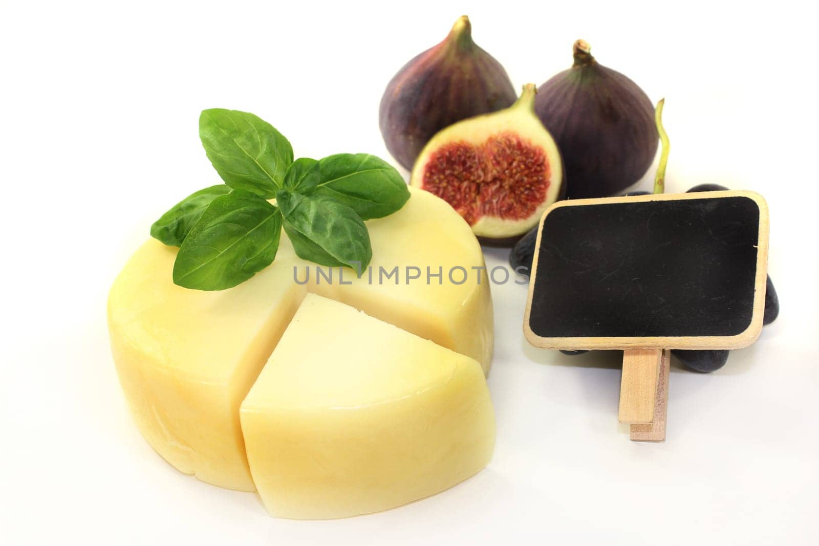 different cheeses against a white background