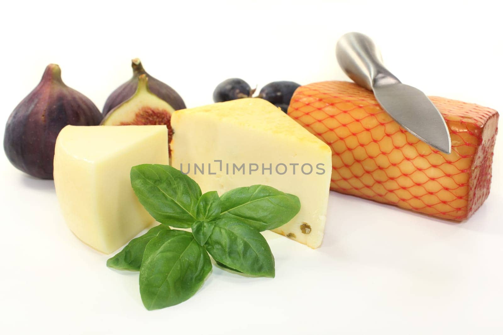 different cheeses against a white background