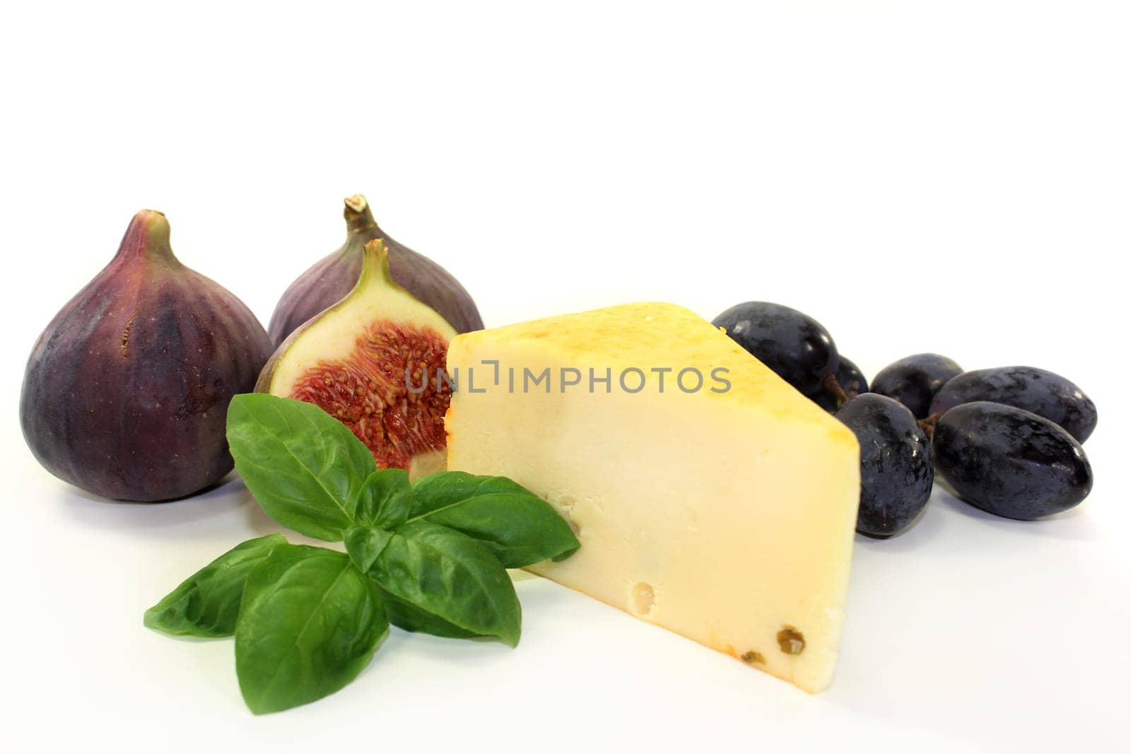 different cheeses against a white background