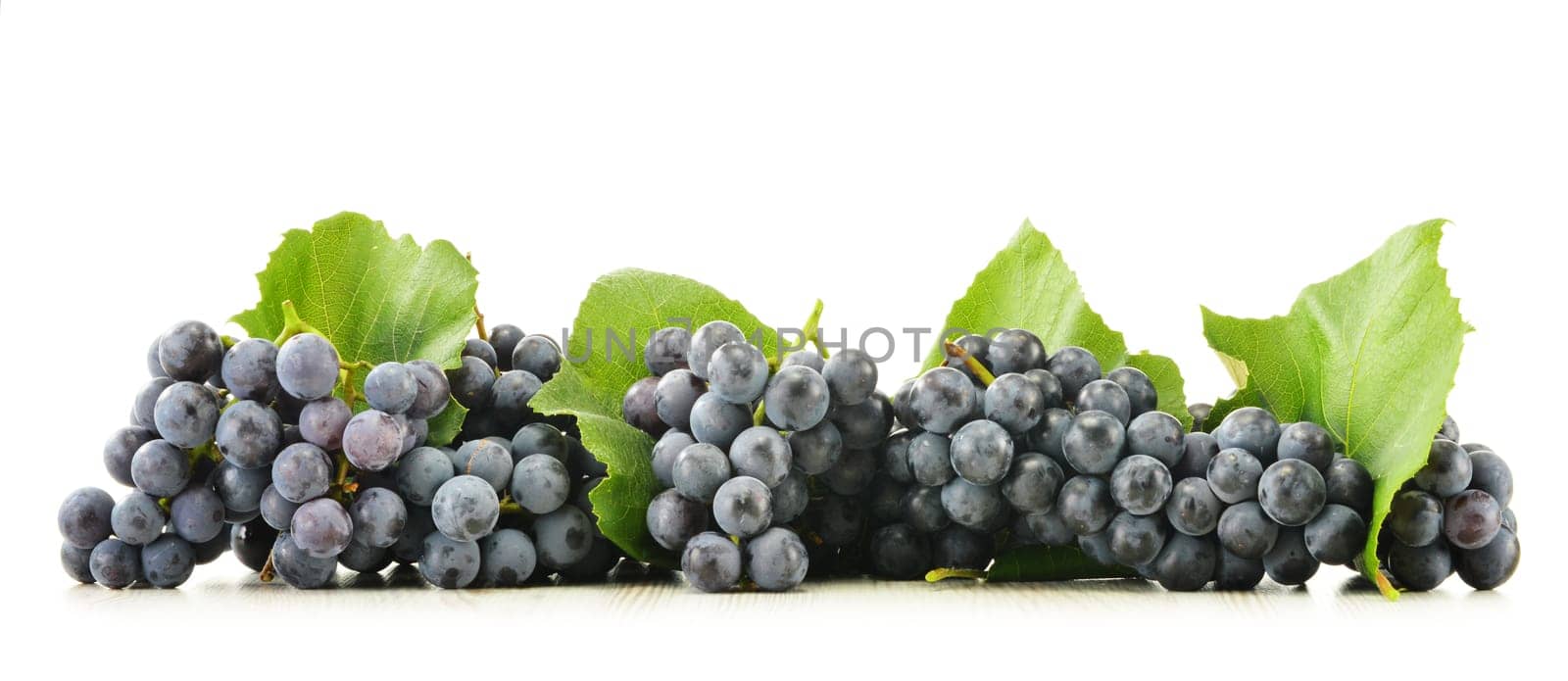 Bunch of fresh red grapes isolated on white