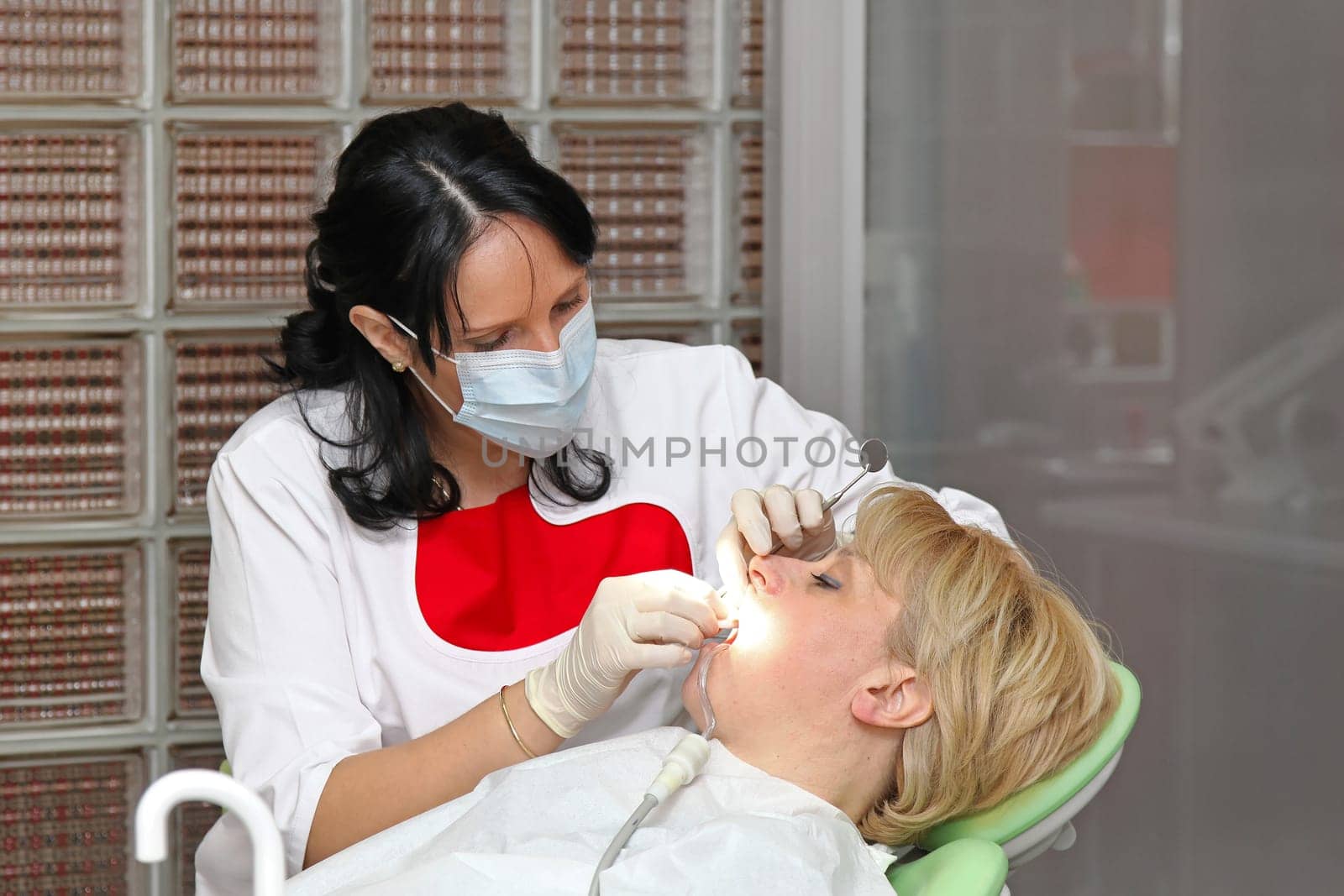 Female patient in chair at dentist office