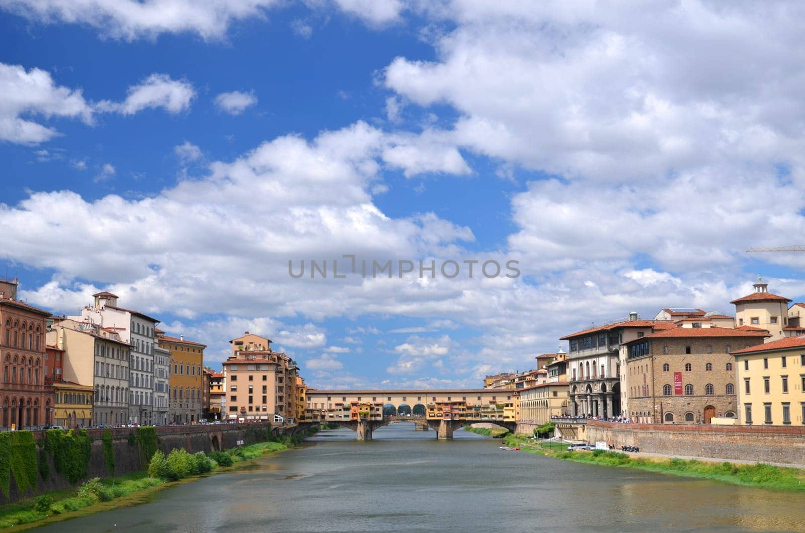 Picturesque view on colorful Ponte Vecchio over Arno River in Florence, Italy