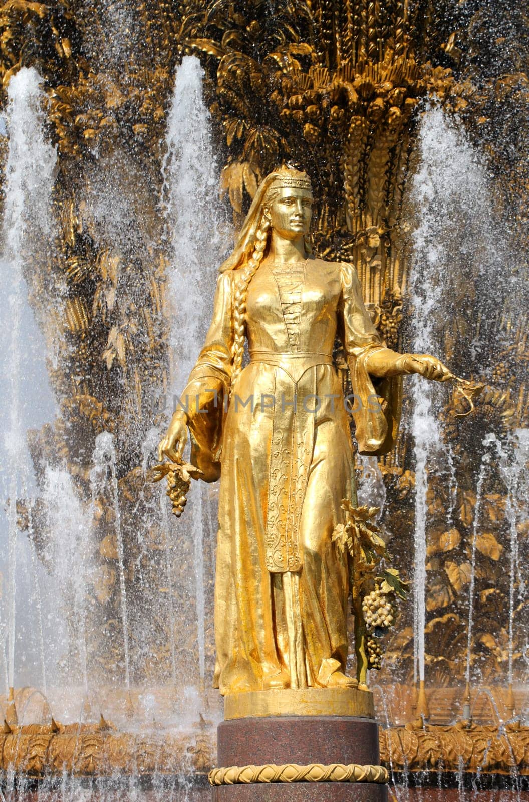 Girl with a fountain of friendship of peoples Georgia