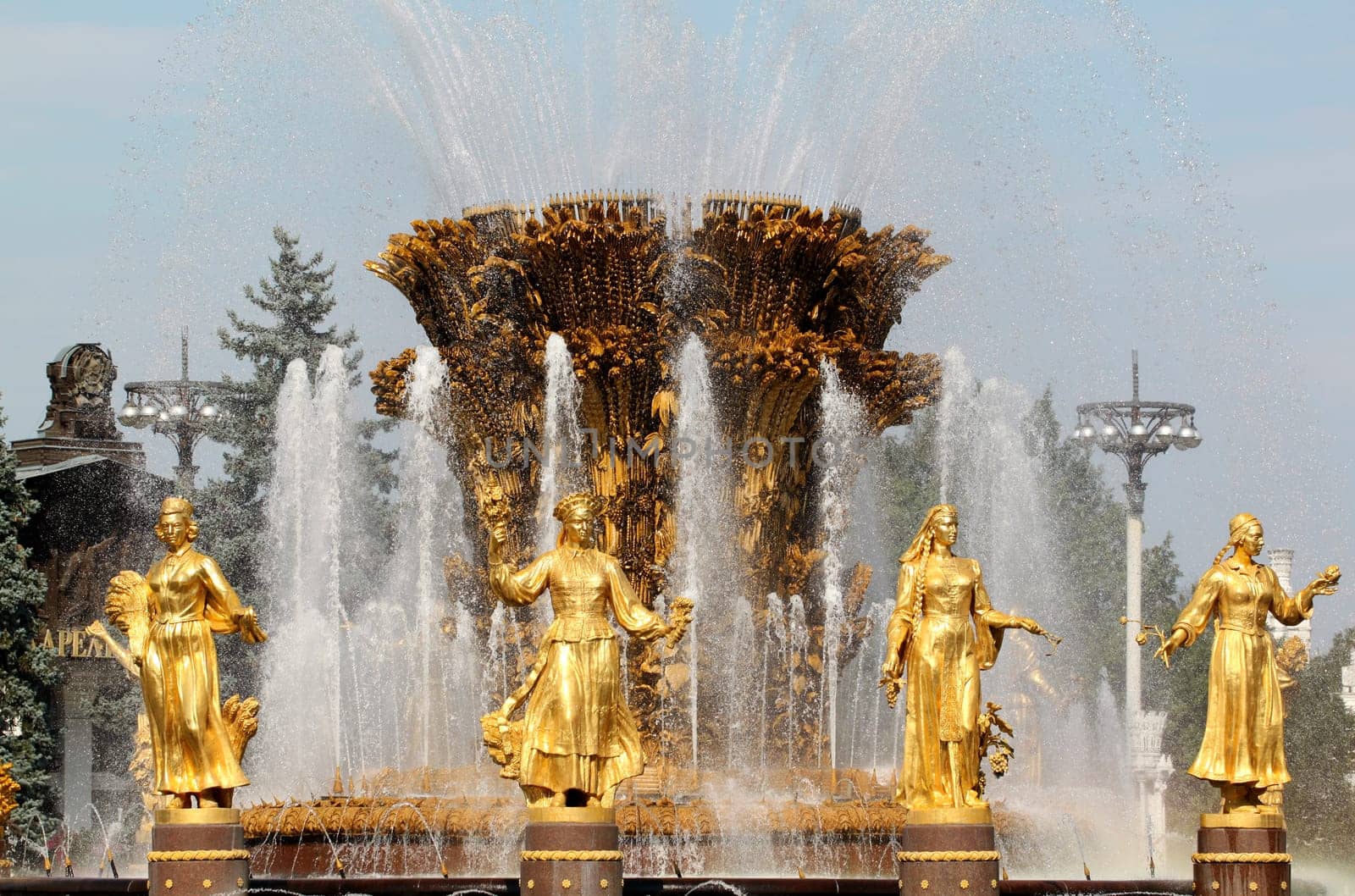 Girl with Fountain of Friendship of Peoples in Moscow on vdnh