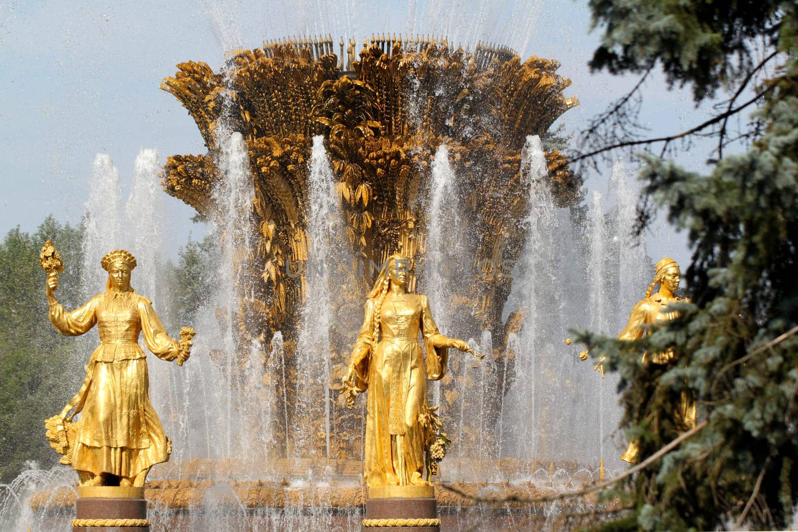 Girl with Fountain of Friendship of Peoples in Moscow on vdnh