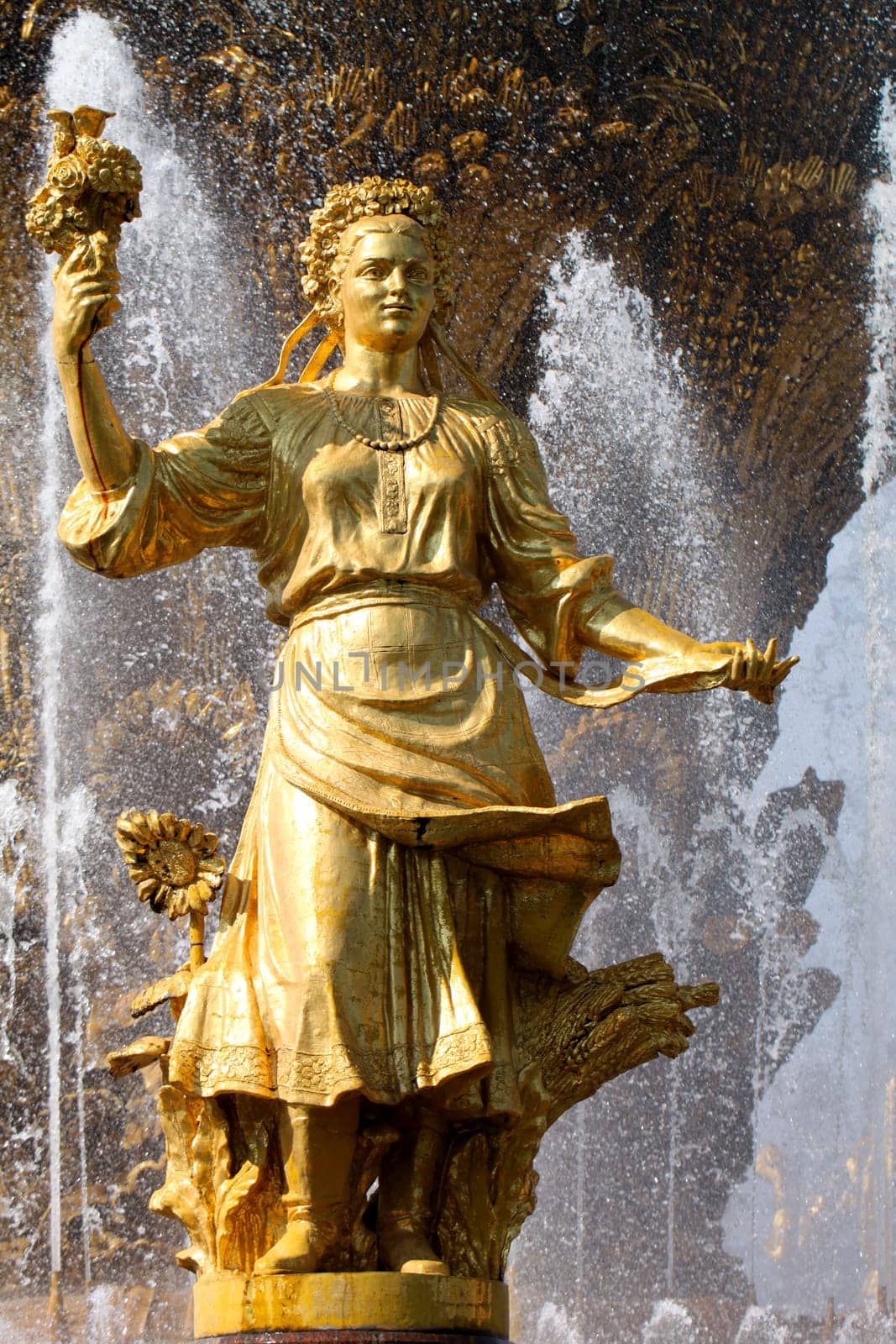Girl with a fountain of friendship of peoples Ukraine