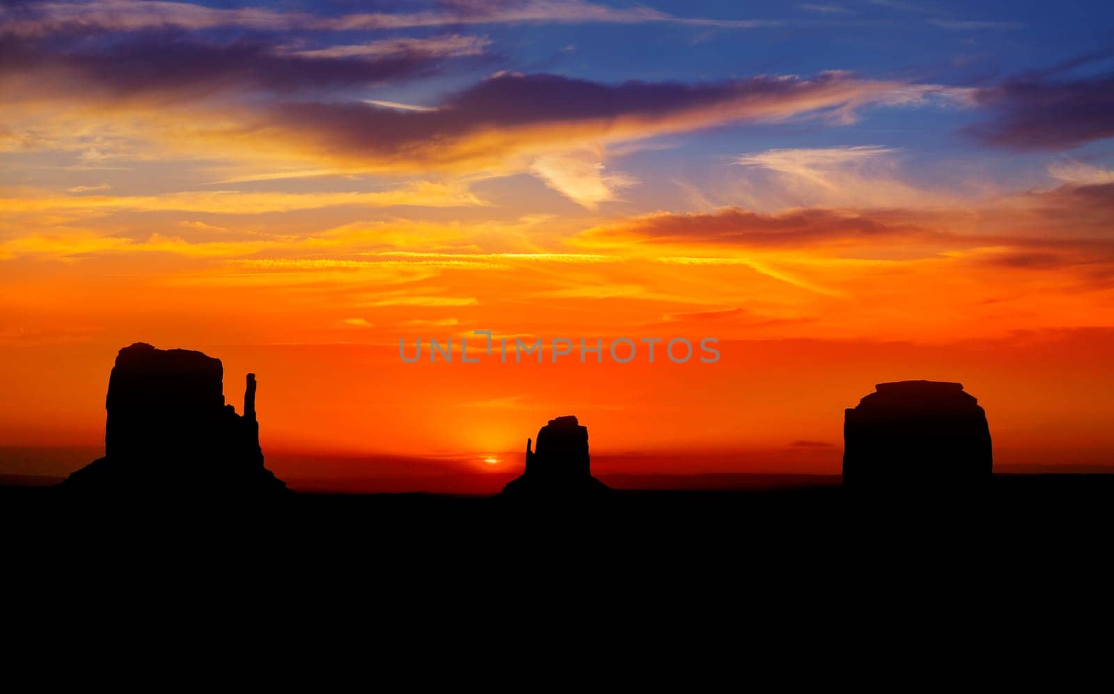 Sunrise at Monument Valley West and East Mittens Butte Utah National Park