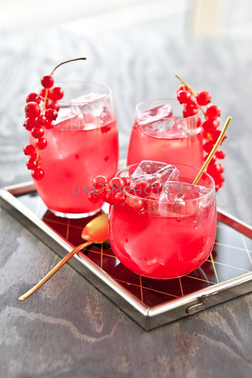 Cold bowl in three glasses with fresh red currants