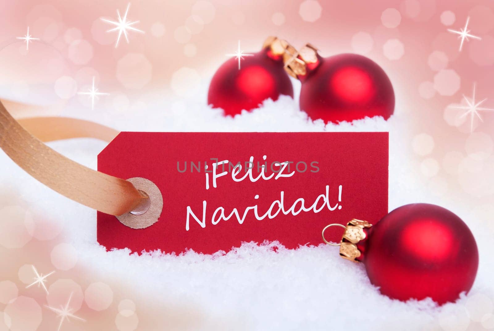 A Red Christmas Label with the Spanish Words Feliz Navidad Which Means Merry Christmas