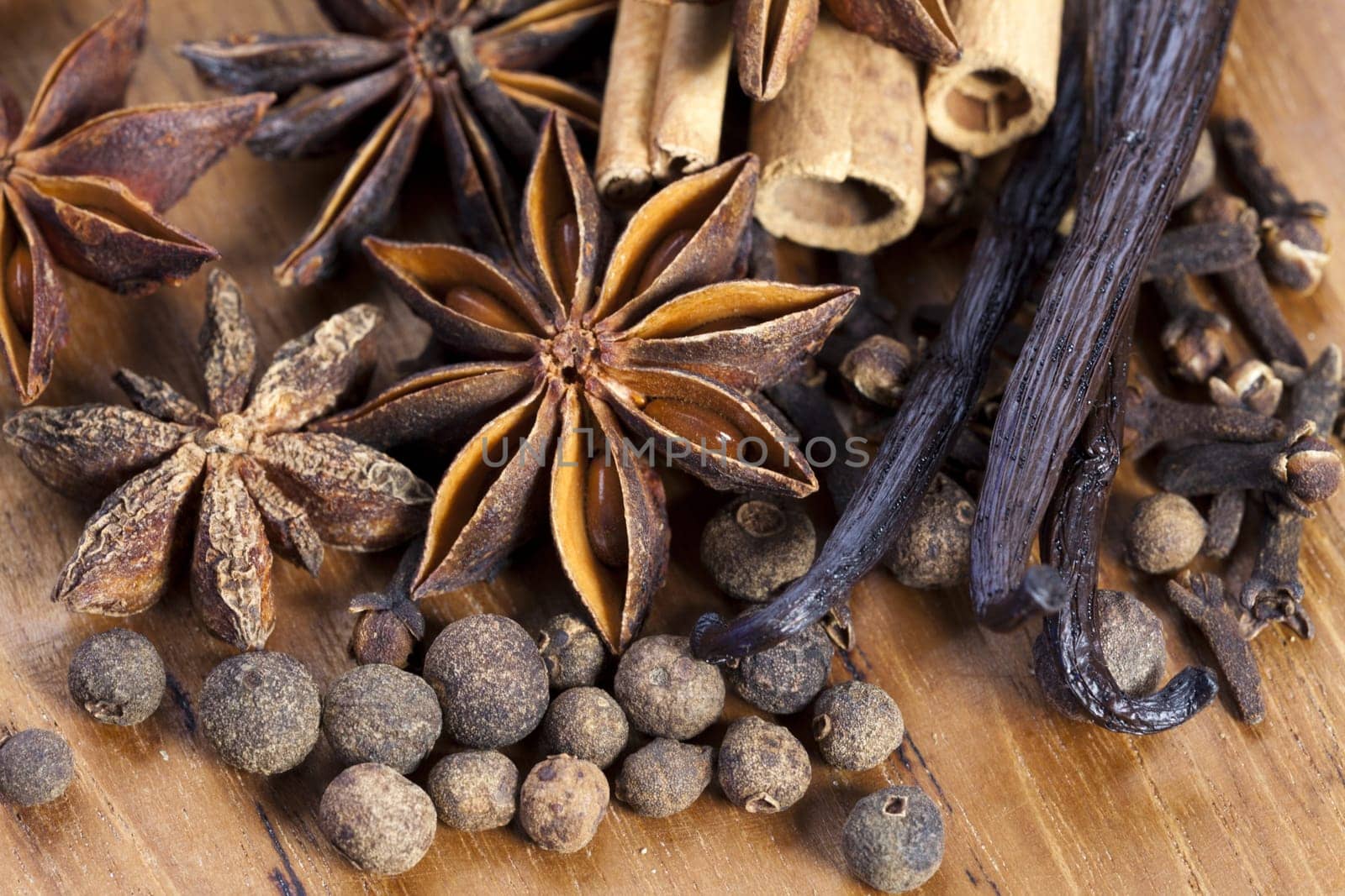 Christmas spices on a wooden surface