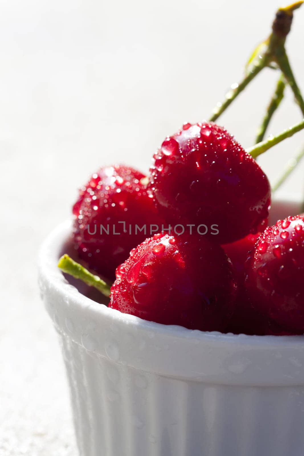 Fresh cherries with water drops in shell