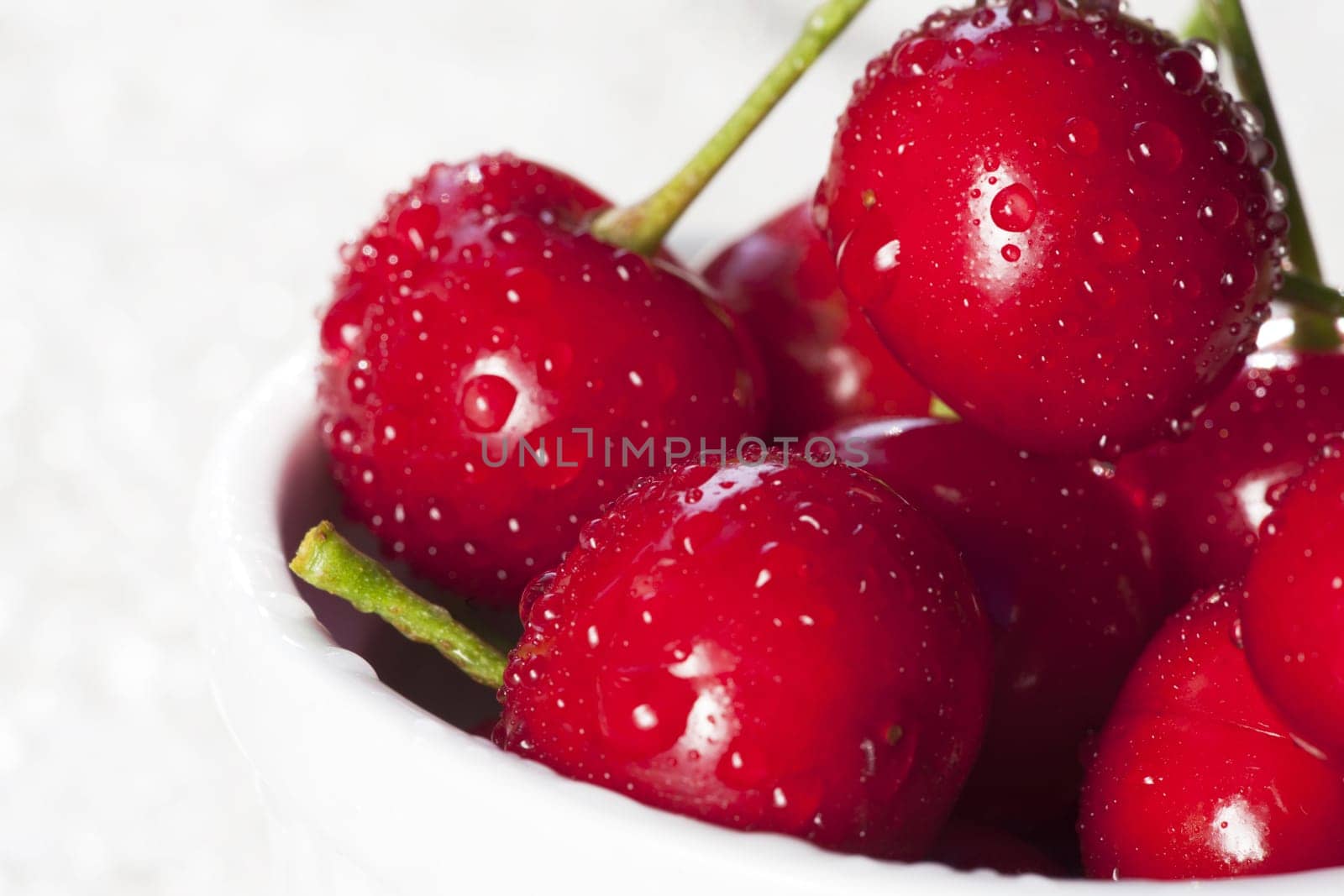 Sweet red cherries with drops of water