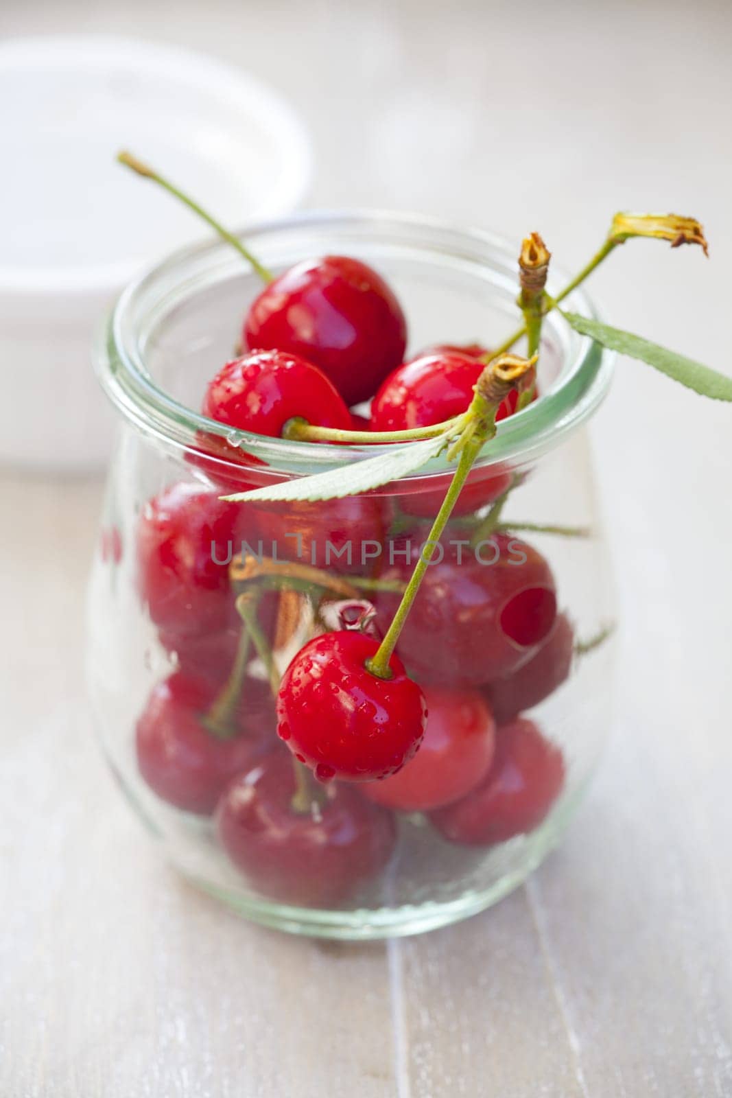 Cherries in a mason jar on the table