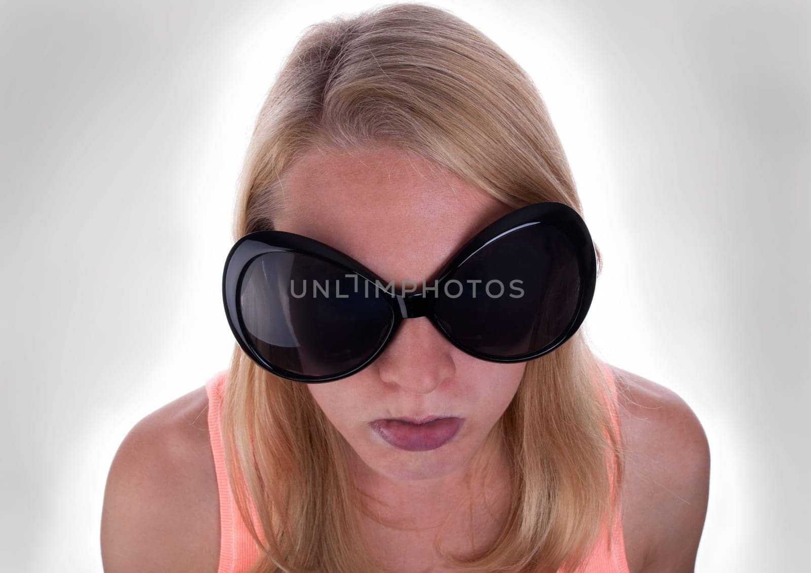 A Sulking Blond Teenage With Gray Background