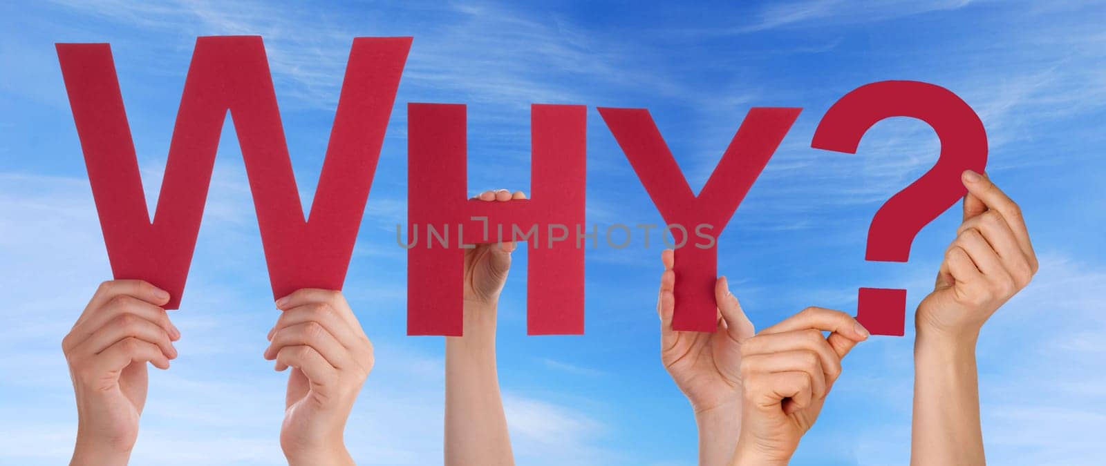hands holding four pieces of a puzzle with copy space, gray background