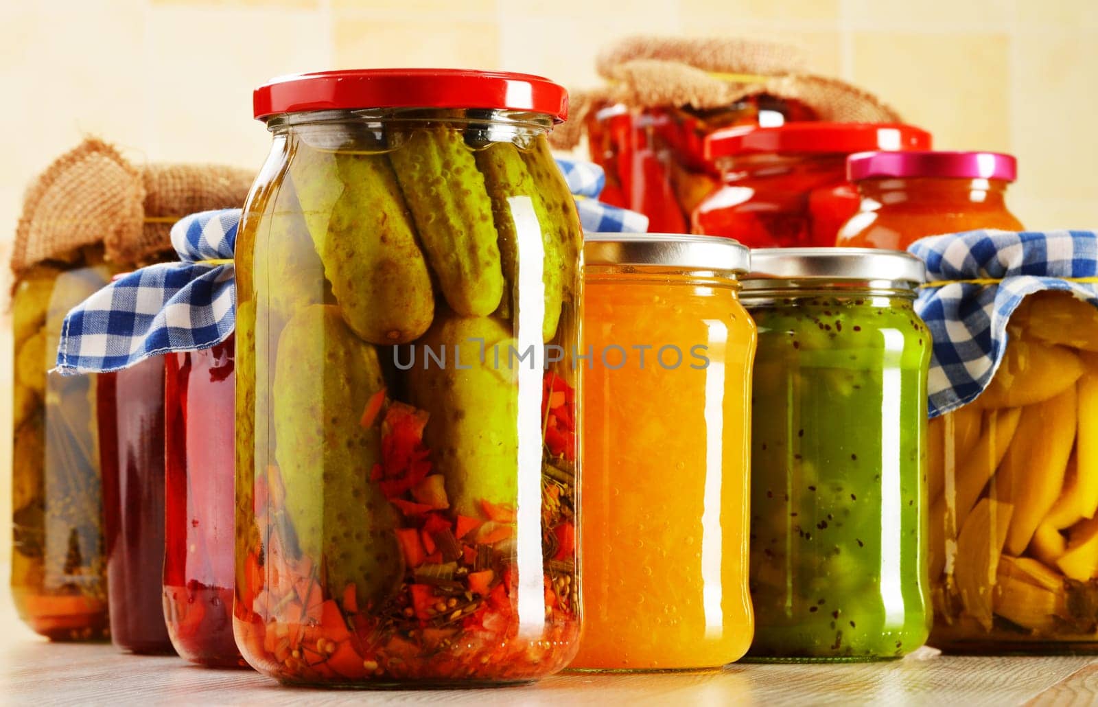 Composition with jars of pickled vegetables. Marinated food