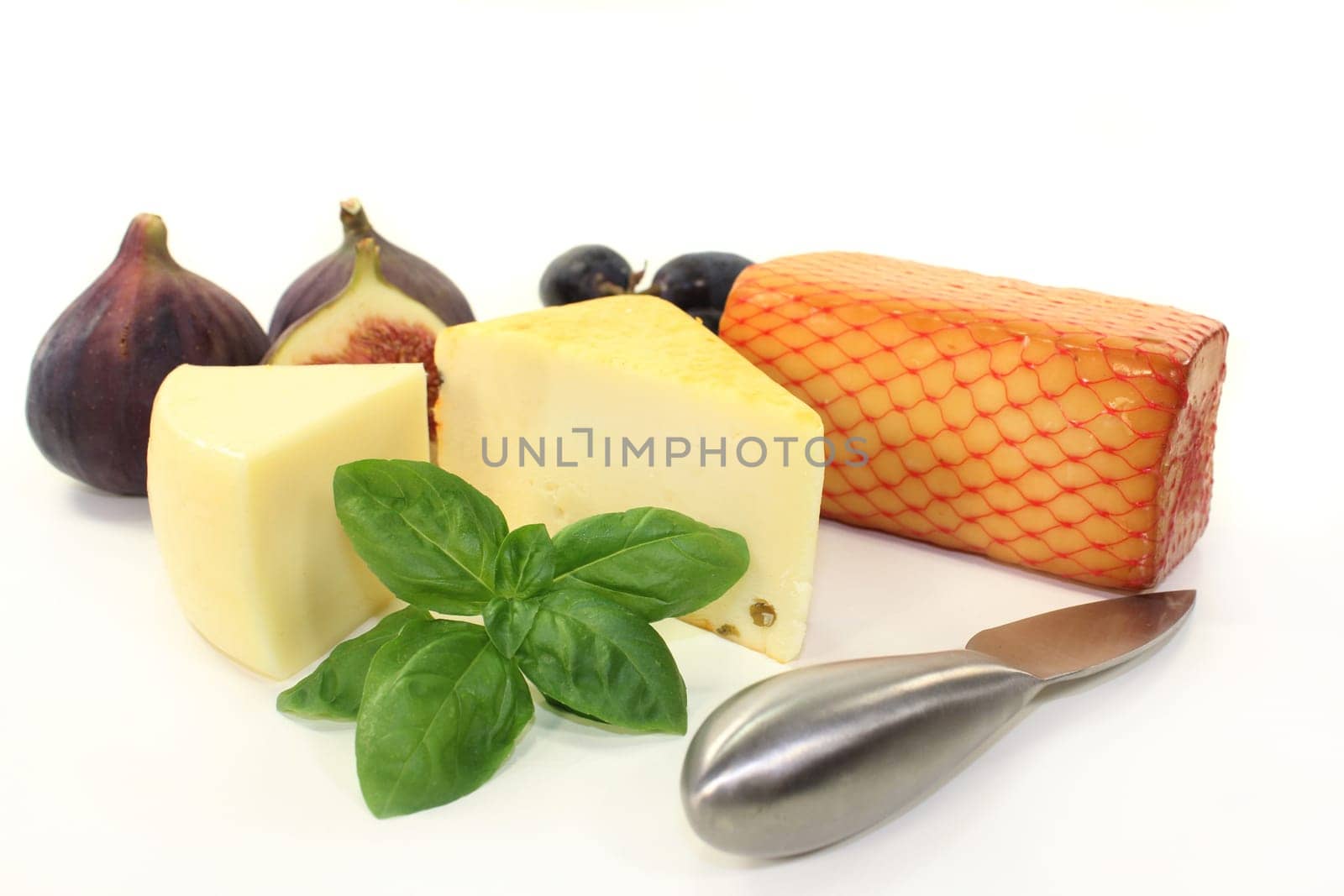 different cheeses against a white background