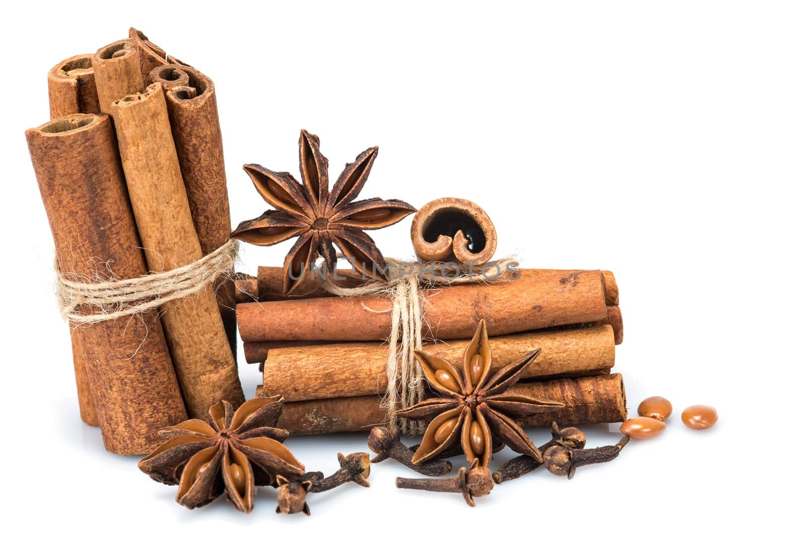 Cinnamon sticks and star anise isolated over a white background