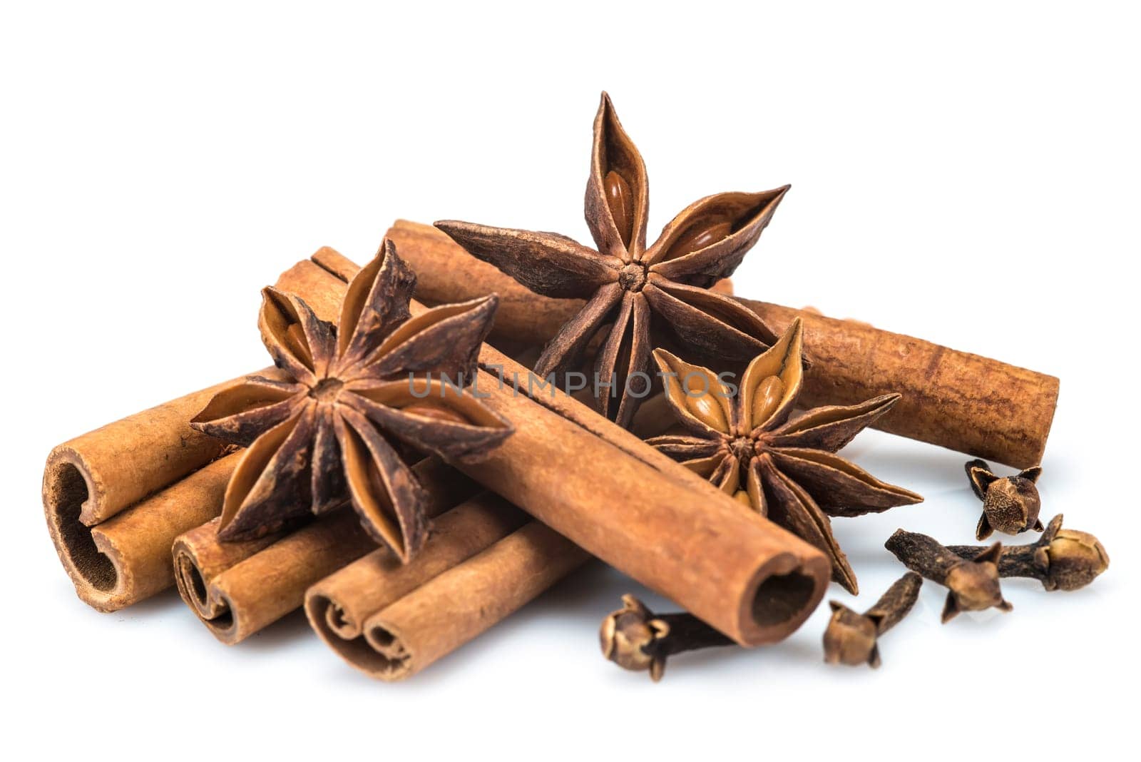 Cinnamon sticks and star anise isolated over a white background