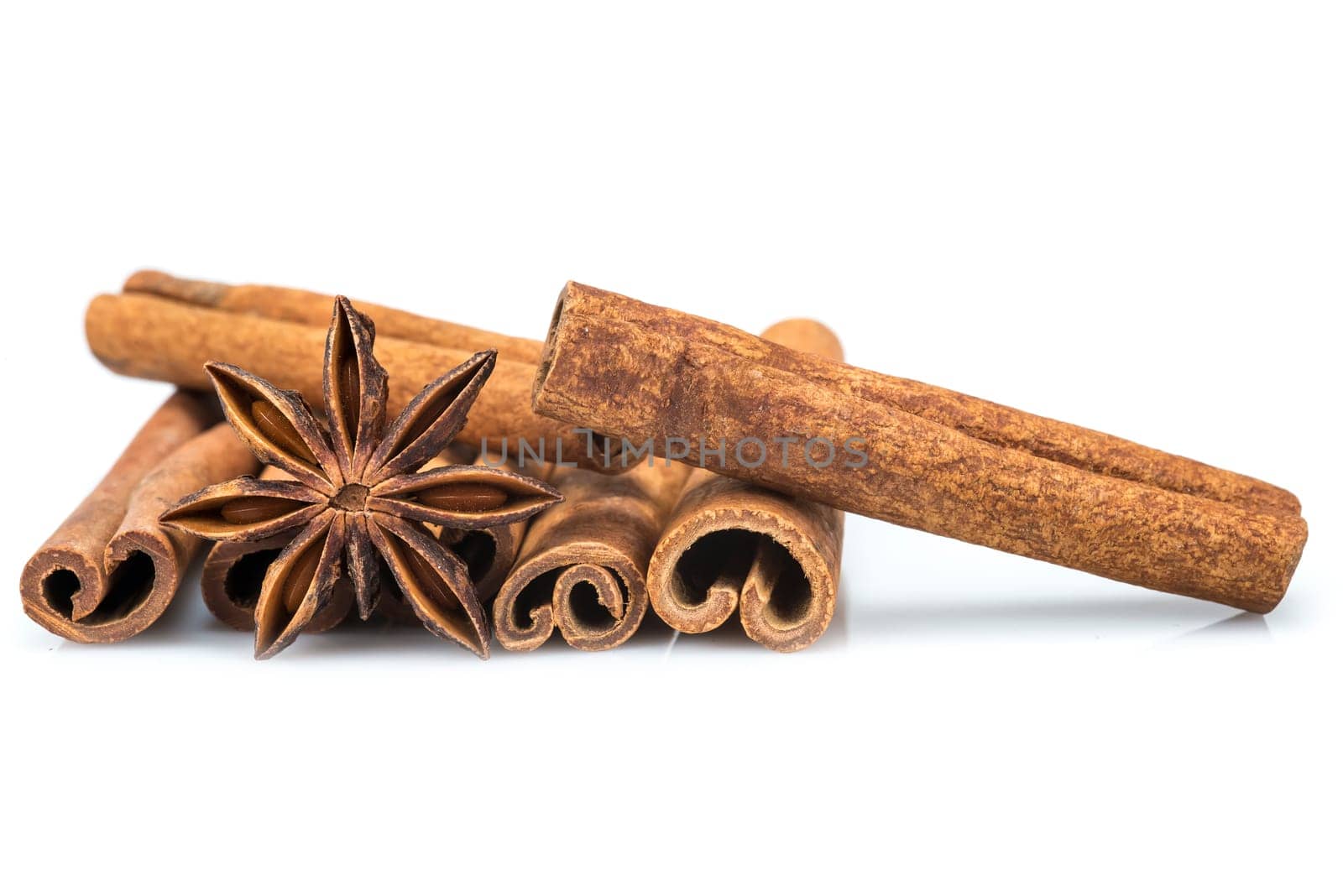 Cinnamon sticks and star anise isolated over a white background