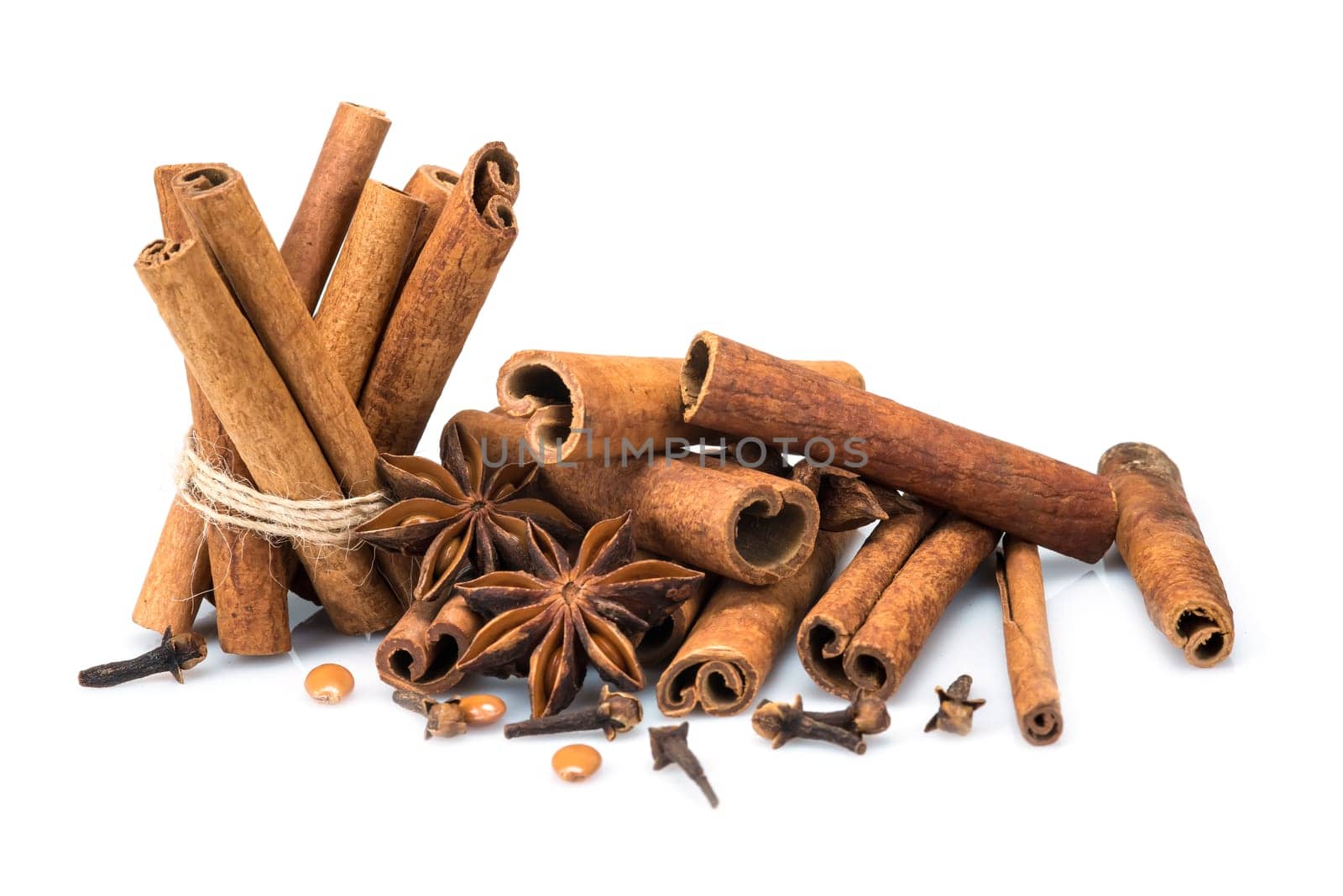 Cinnamon sticks and star anise isolated over a white background