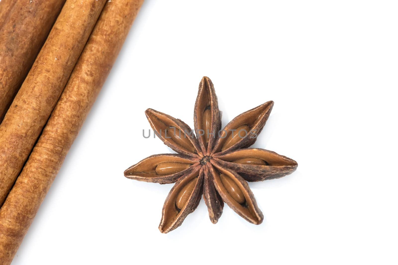 Cinnamon sticks and star anise isolated over a white background