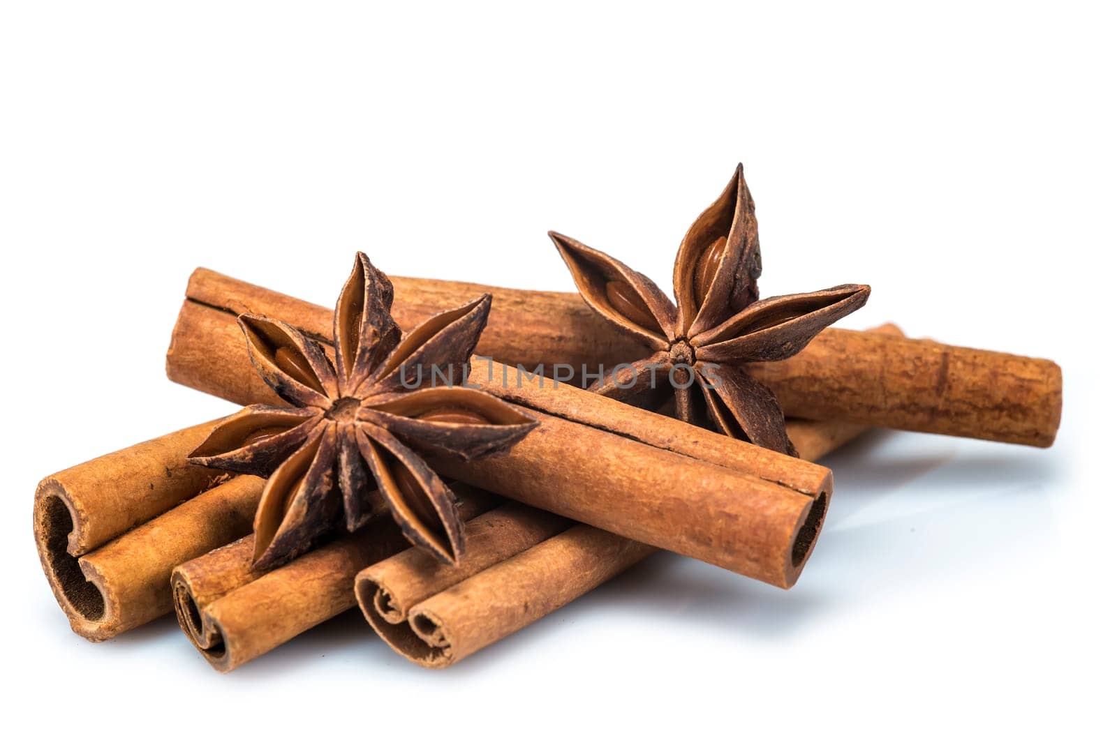 Cinnamon sticks and star anise isolated over a white background