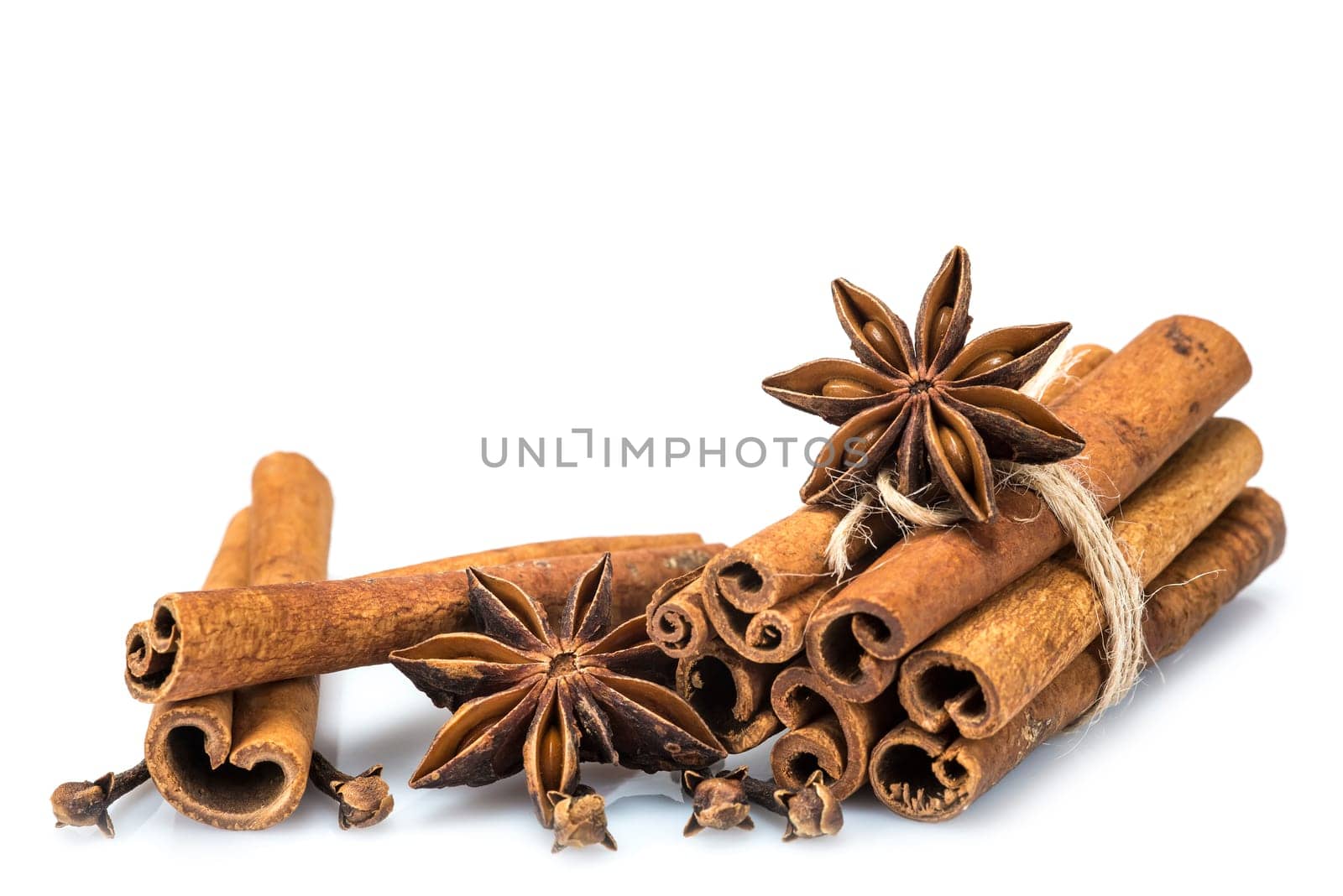 Cinnamon sticks and star anise isolated over a white background