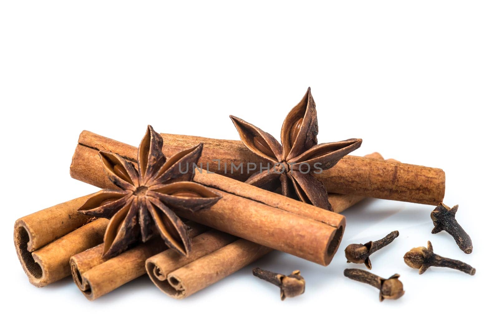 Cinnamon sticks and star anise isolated over a white background