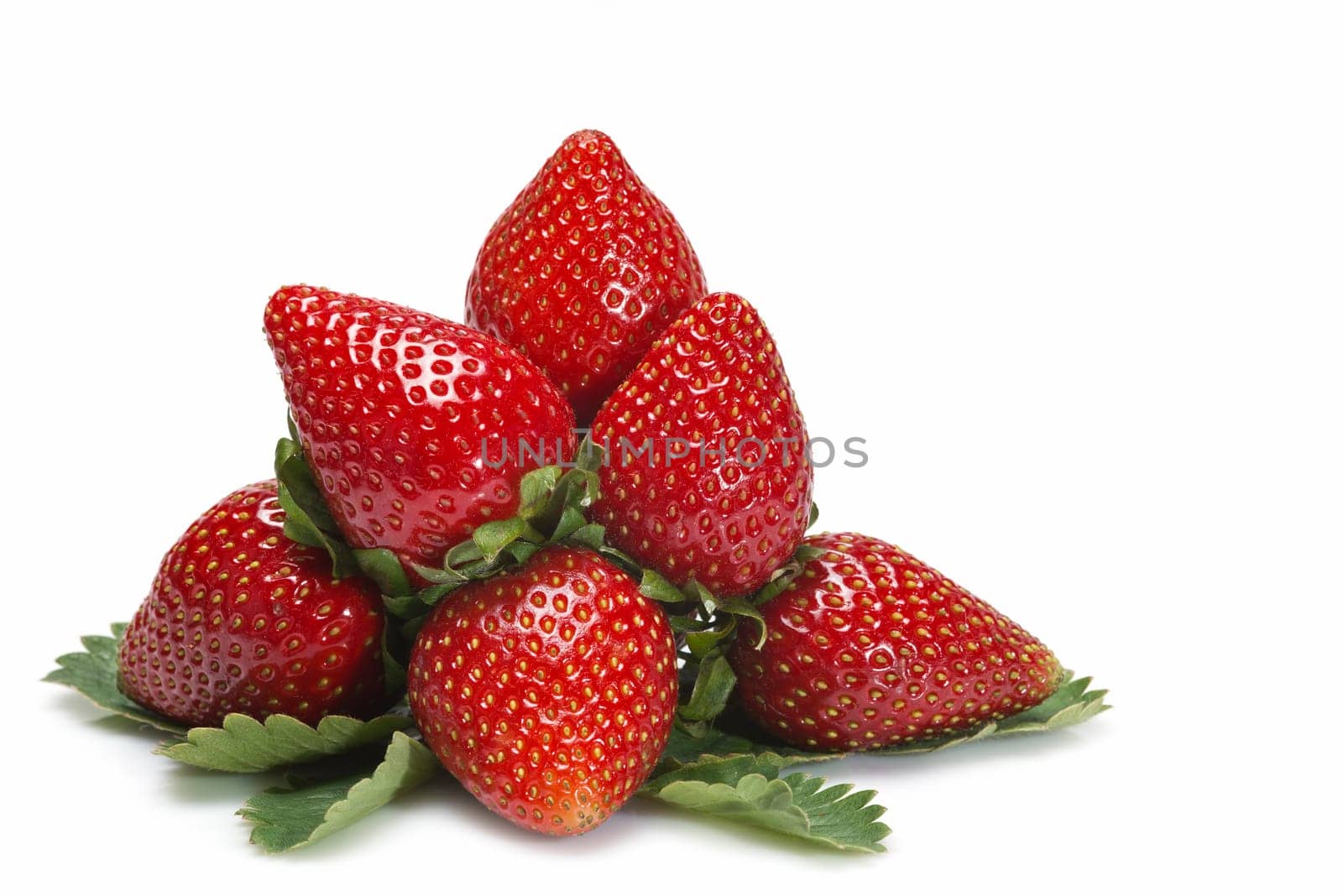 Strawberries with their leaves isolated on a white background