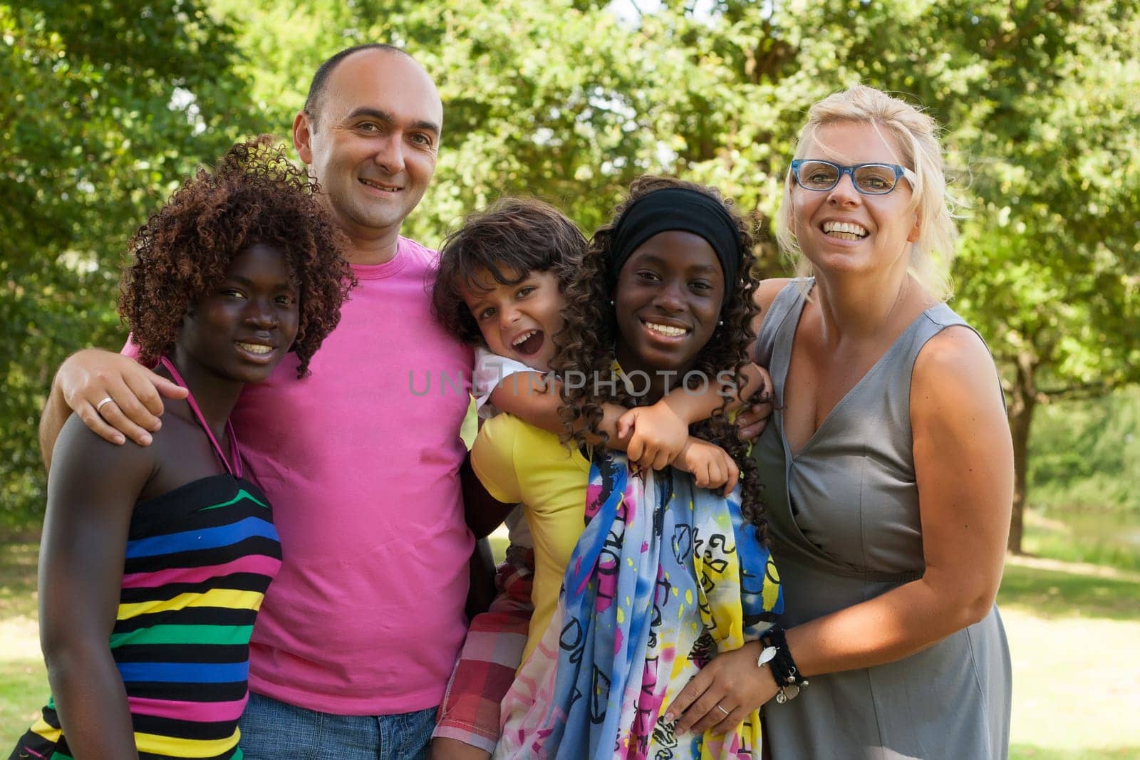 Happy multicultural family having a nice summer day