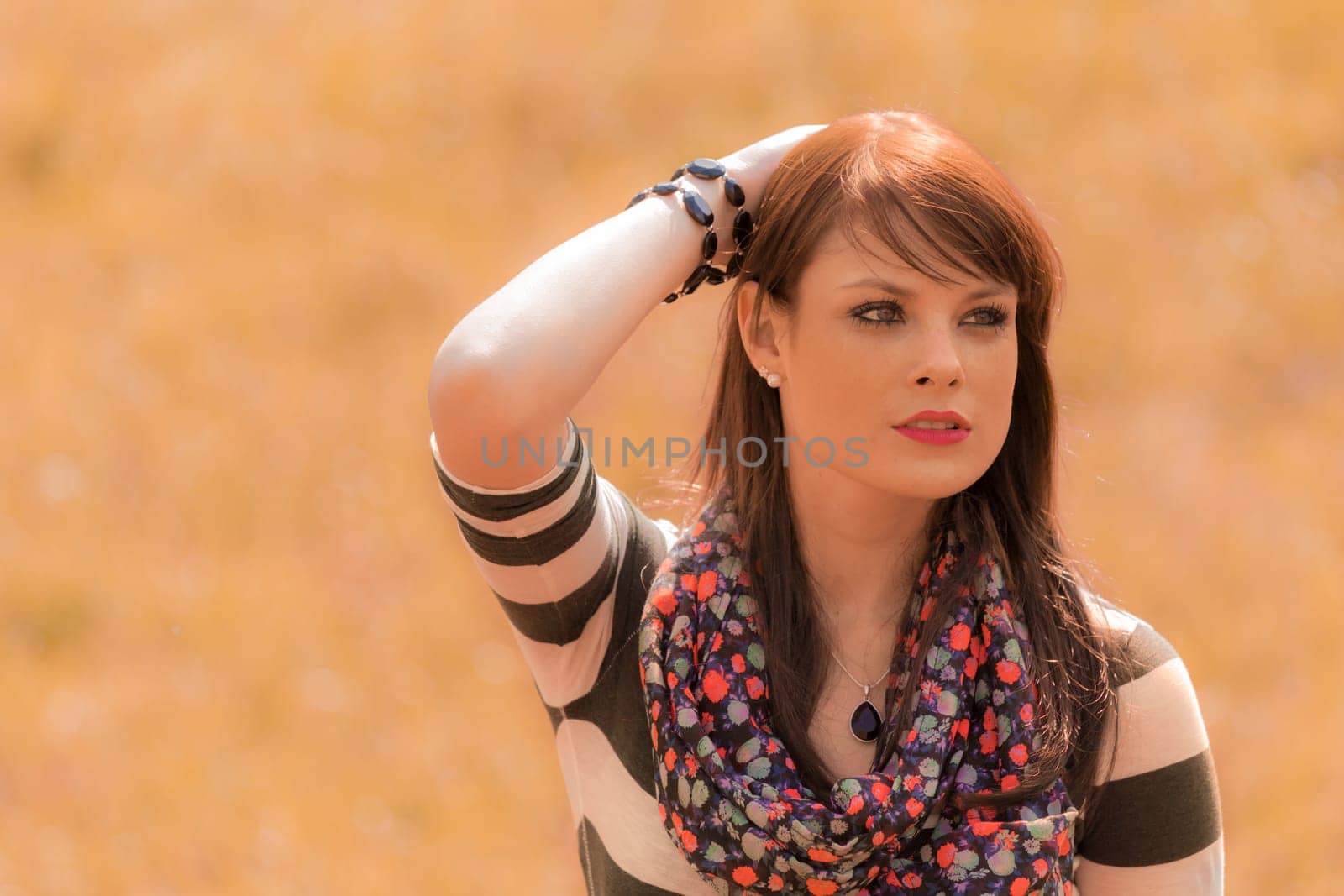 Portrait of a nice looking and thoughtful woman. Outdoor in summer or fall. With copy space.