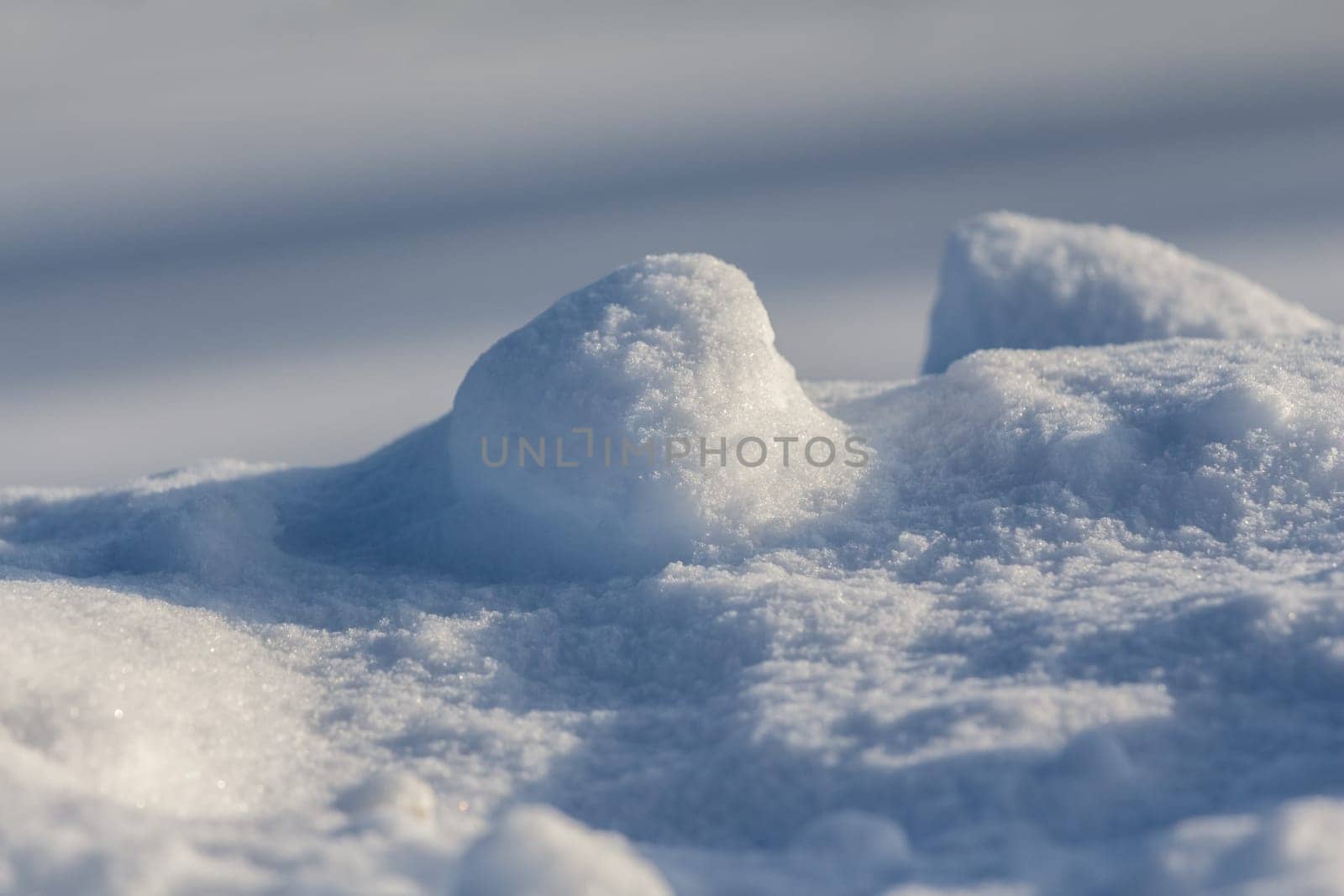 Cool picture of fine snow covering ice at the height of winter. With copy space.