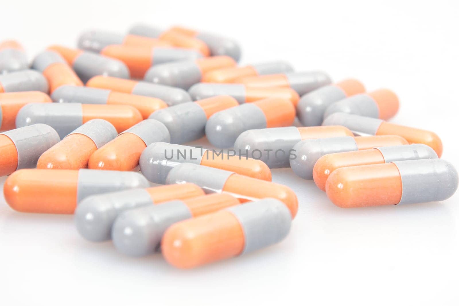 Orange and grey tablets close up