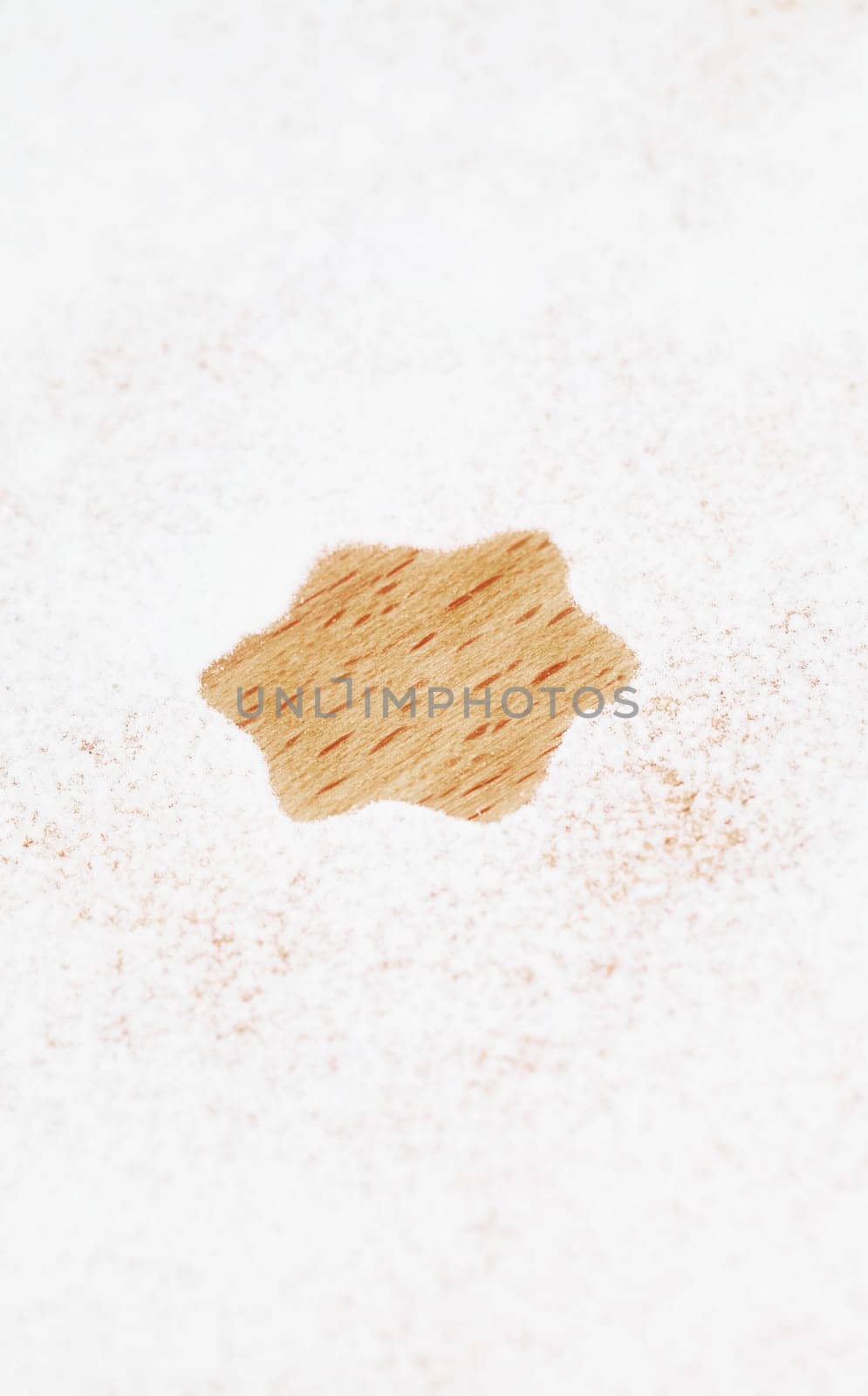 Star shape for Christmas in flour on wood