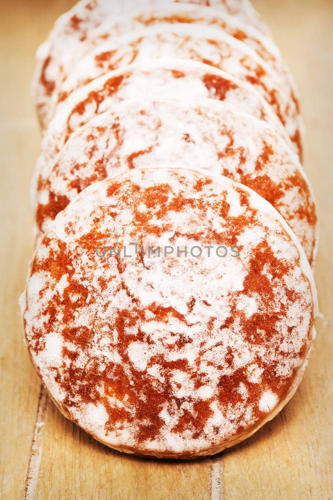 Gingerbread in rows on a wooden surface