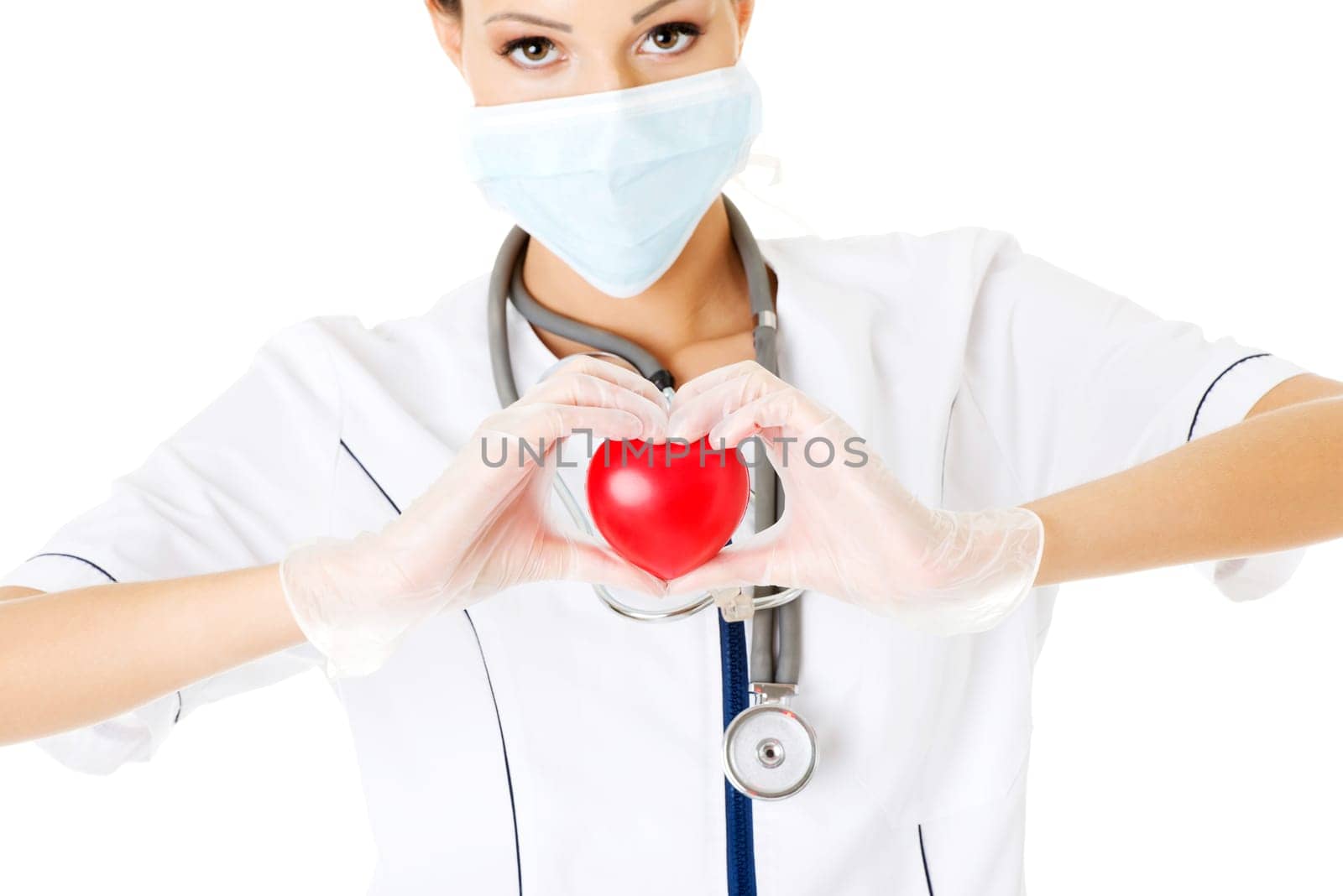 Young nurse with heart in her hand , isolated on white.