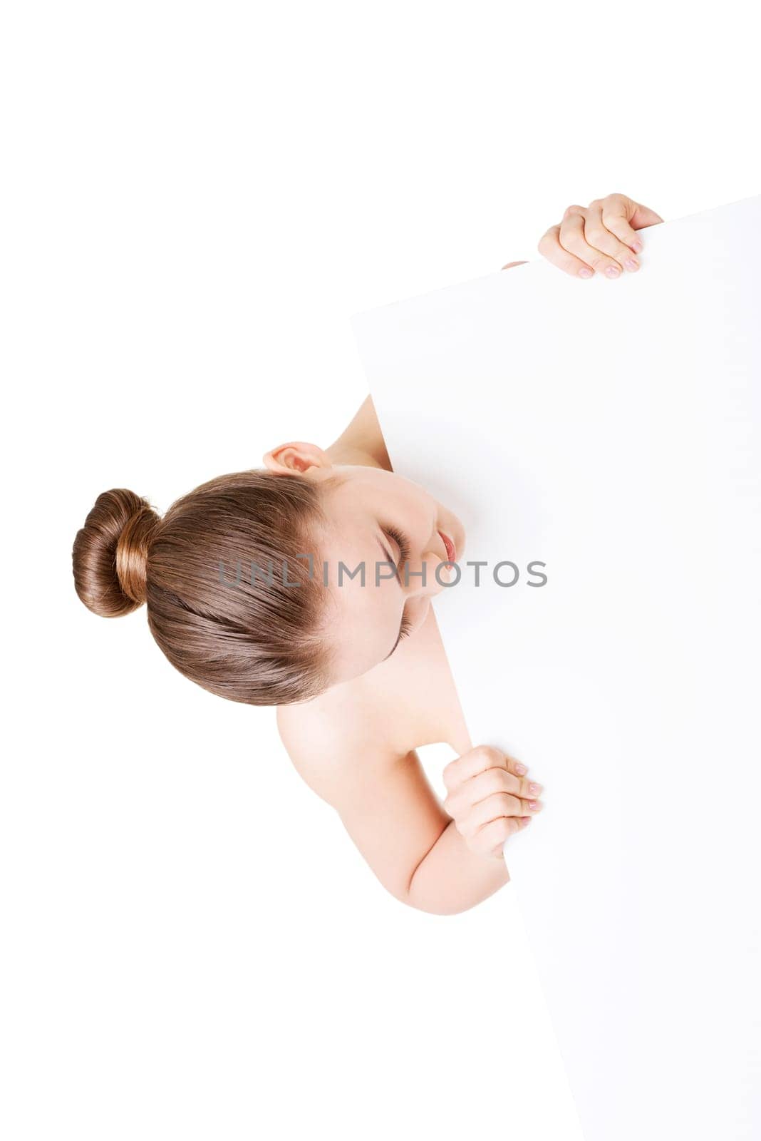 Beautiful woman with perfect skin and beautyful face holding blank board. Isolated on a White Background.