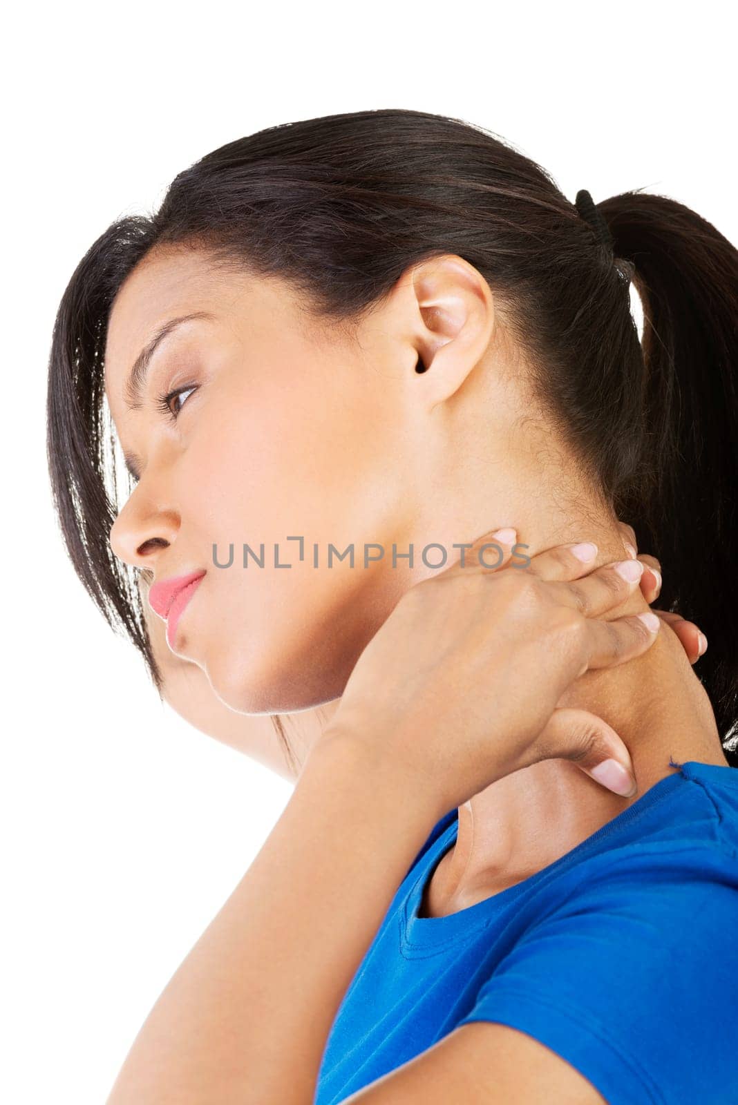 Young woman holding hand on her neck. Neck pain concept
