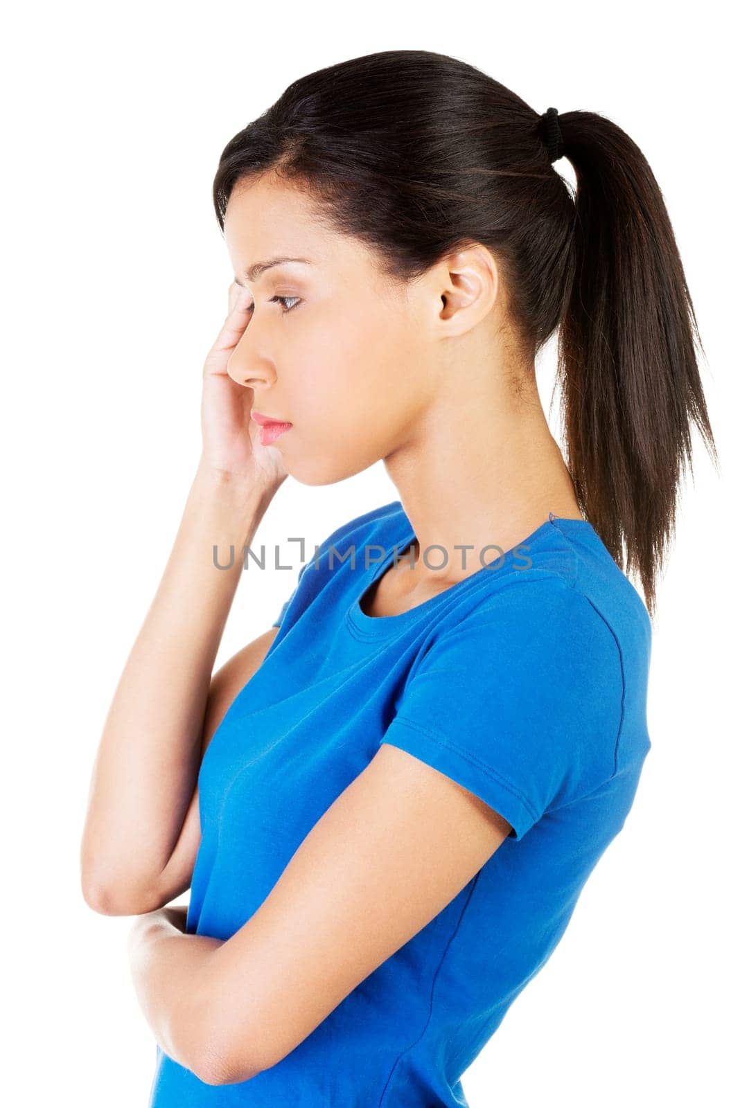 Young beautiful woman in depression. Isolated on white background.