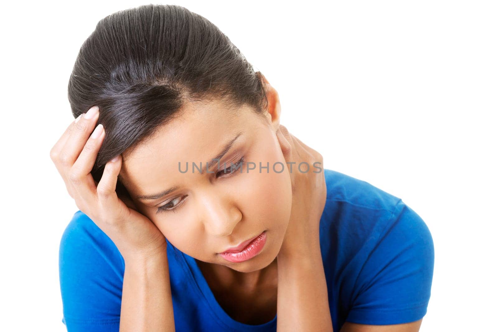 Young beautiful woman in depression. Isolated on white background.